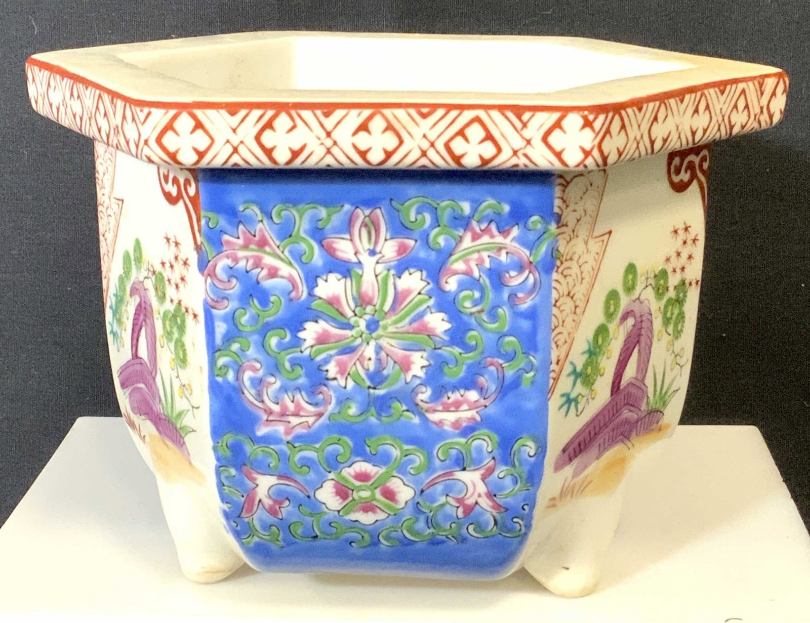 JAPANESE PORCELAIN Ornamental Planter, SIGNED: Hand Painted Hexagonal footed planter, has draining hole, white porcelain, possibly vintage, Alternating panel designs, rich blue with pink flowers and garden scene. Underside has red ink stamp flush 