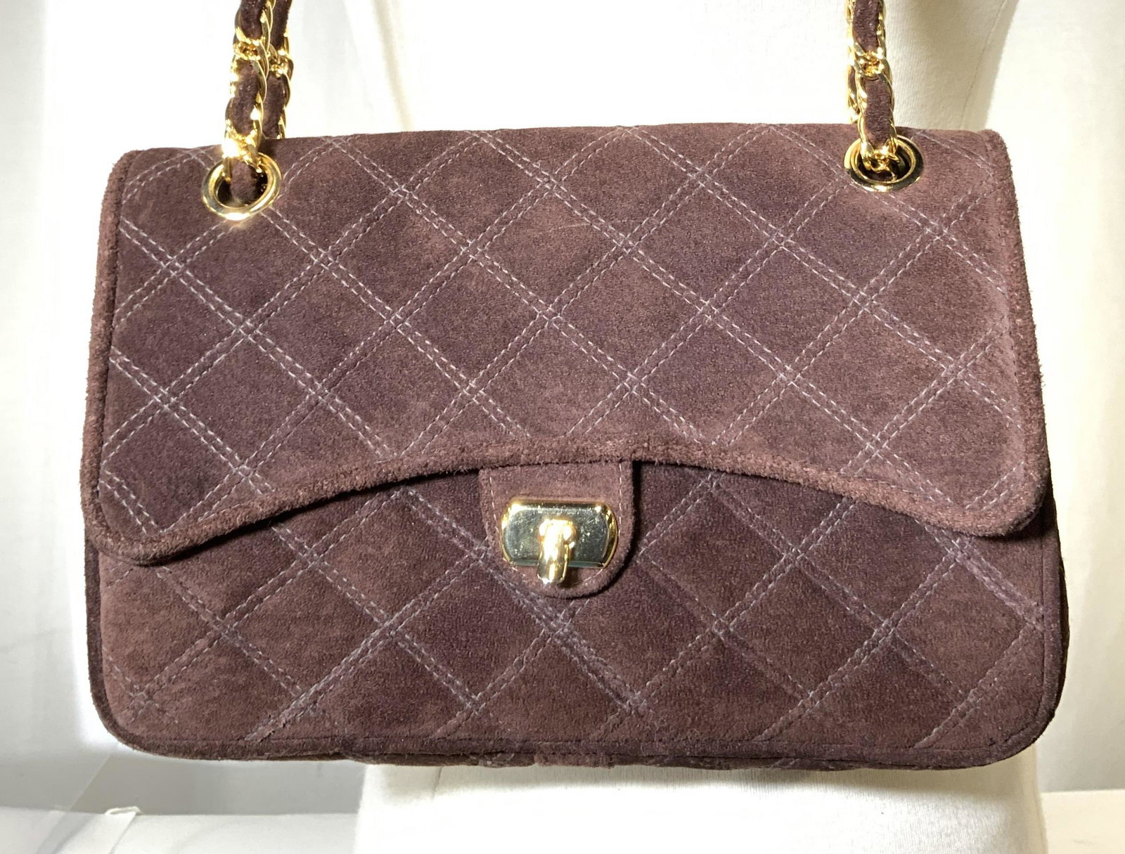 MEYERS USA Quilted Suede Handbag, signed: Classy everyday purse that operates as a handbag ( 10 in drop) Gold tone chain wraps around suede cord and slides, expanding to a shoulder length strap 19 in drop) . Chocolate brown suede has a diamon
