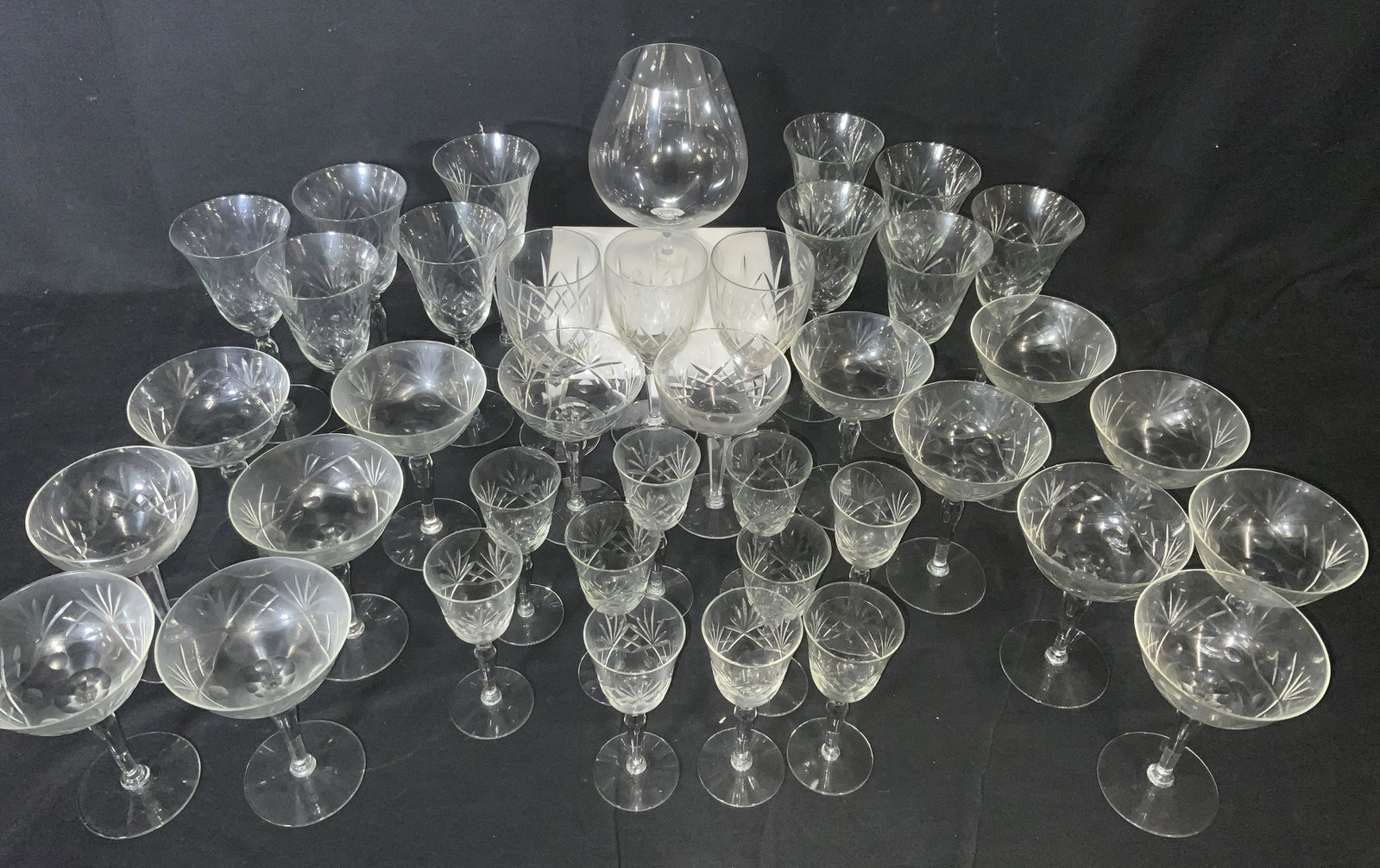 Set 36 Vintage ETCHED HAND FORMED CRYSTAL Stemware: Etched crystal stemware, slightly different crystal widths and heights. Vintage set includes aperitif, oversized snifter 8.5 in ht, 6 in width, vintage champagne / martini glasses, and bell shape wine