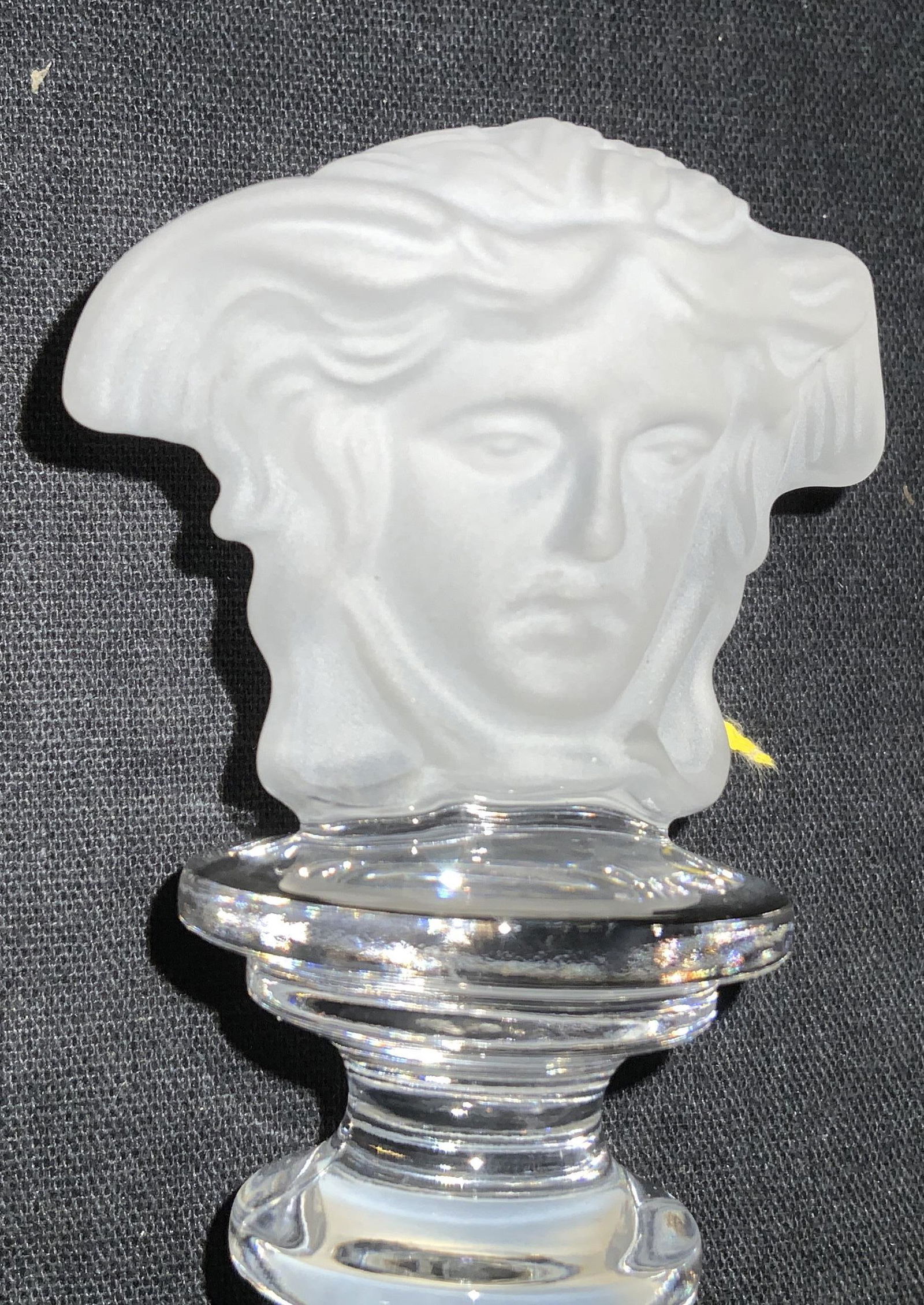 VERSACE ROSENTHAL Medusa Crystal Stopper, Org Box: A luxury vintage decanter stopper, VERSACE MEDUSA HEAD LOGO carved of frosted glass. Stamped on Piece, reads Rosenthal Versace. Org sticker reads ‘ over 24% lead crystal’ Comes in original box wit