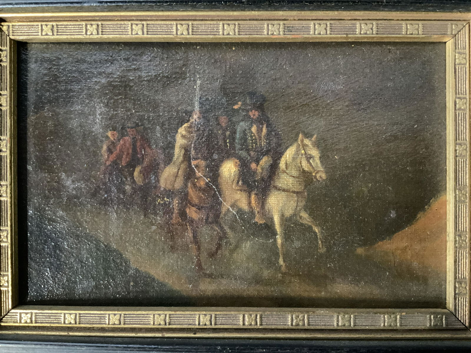 Oil Painting, Men Riding Horses: Oil on board Painting, Men Riding Horses, no apparent inscriptions or signatures, subject men riding horses along a road, measures 5 1/4 x 7 1/4 inches, black wooden frame, some chips to frame but ove