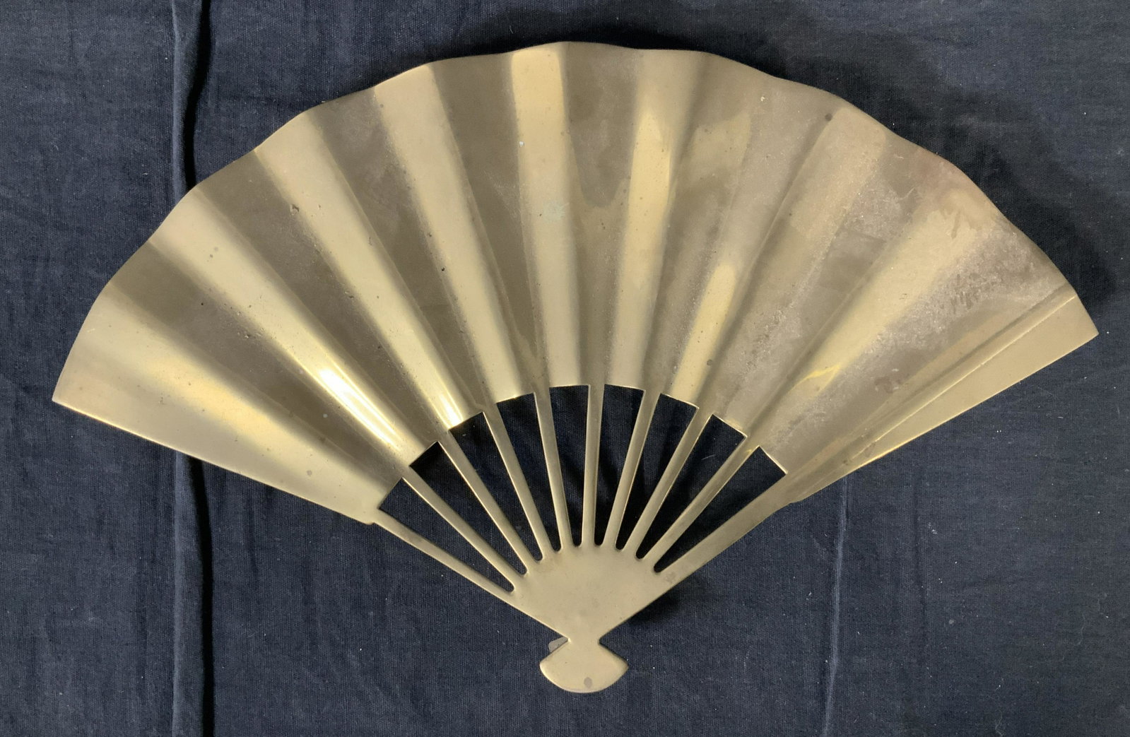 DEPT 56 Brass Fan, Taiwan: DEPT 56 Brass Fan, Taiwan, label to fan reads ‘Made in Taiwan for Dept 56’, Measures 7 1/2 x 12 1/4 inches at widest point, some surface wear, missing protective foot covering but overall in good 