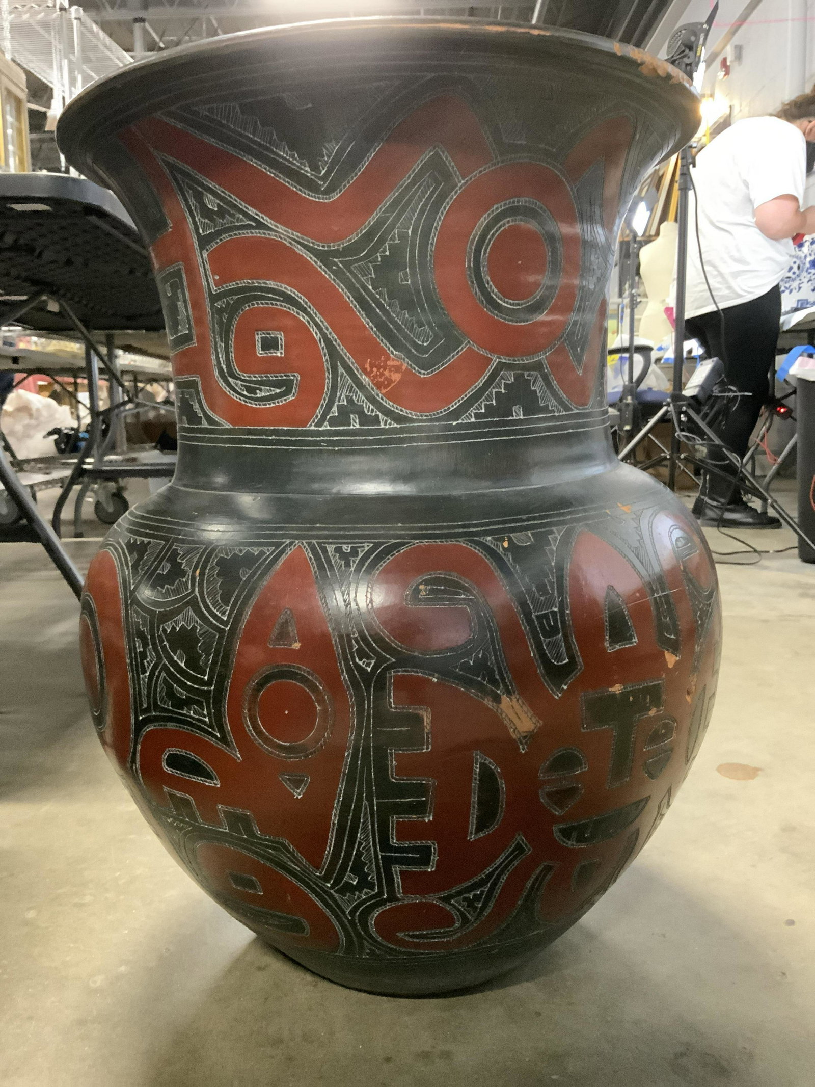 Terra Cotta Jardiniere Oversized Floor Vase 25.5 H: Hand formed pottery with primitive etched and hand painted decor. Floor Jardiniere vase/ vessel or home decor floor decorative vessel that stands 25.5 in. Tall. App 23 in. at widest width. Some wear t