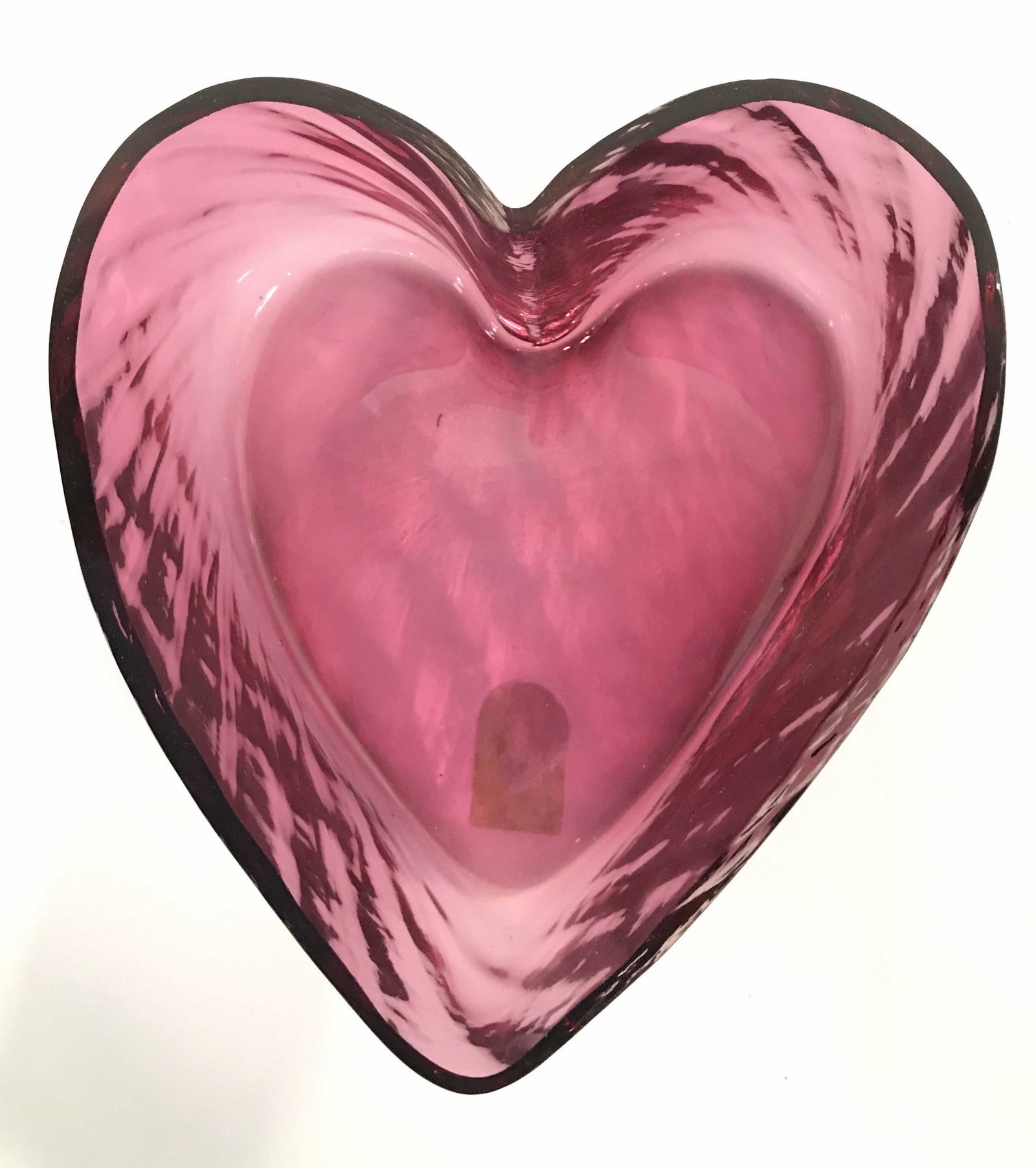 Lot 3 Cranberry Glass Tabletop Accessories: Underside of Art glass heart has tag which reads PILGRIM CRANBERRY GLASS. Lot includes heart shaped trinket bowl, & 2 art glass birds. Each piece is cranberry toned. Heart shaped trinket bowl measures