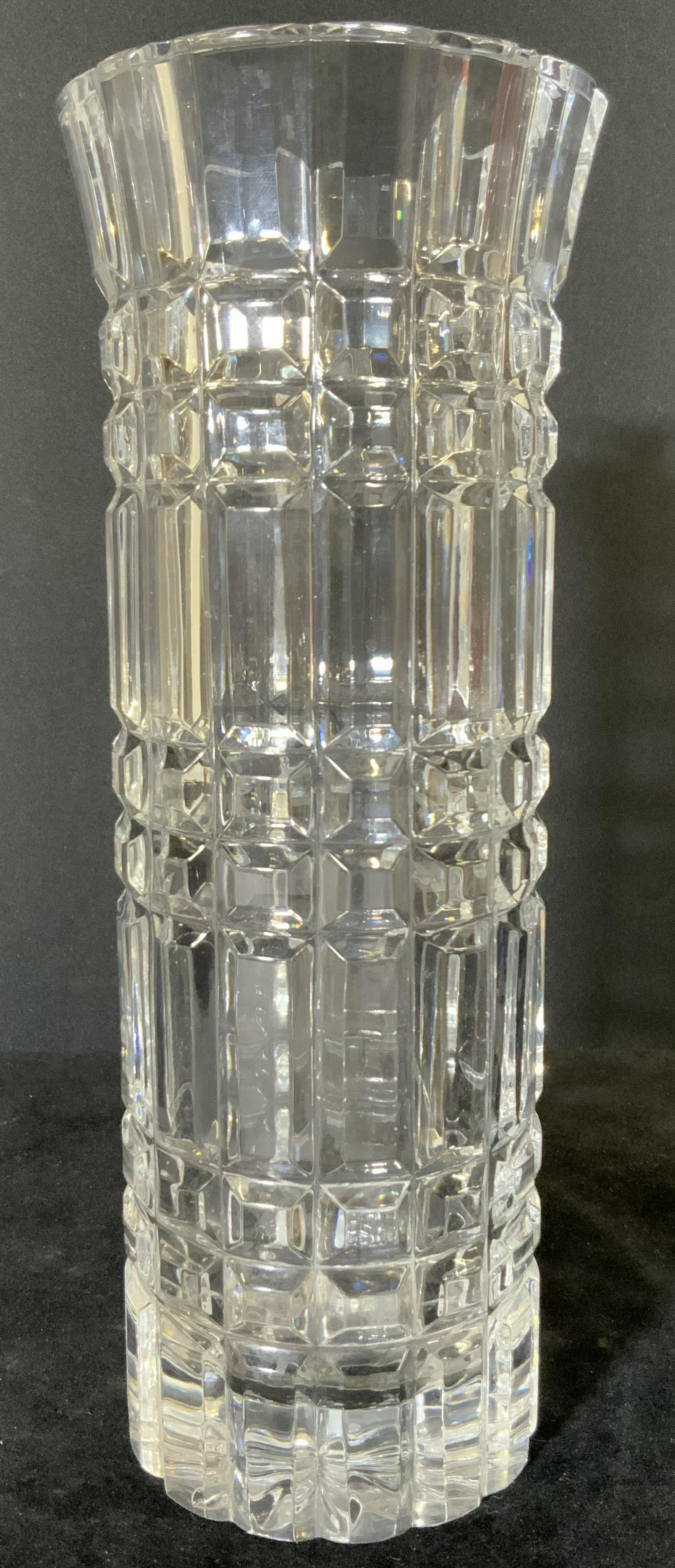 Vintage Clear Cut Crystal Tabletop Vase: Rectangular and square cut designs into through this piece. Weighty, thick walled crystal. Interior of the vase is smooth. Underside is cut crystal resembling a flower shape. Mild surface scratch near