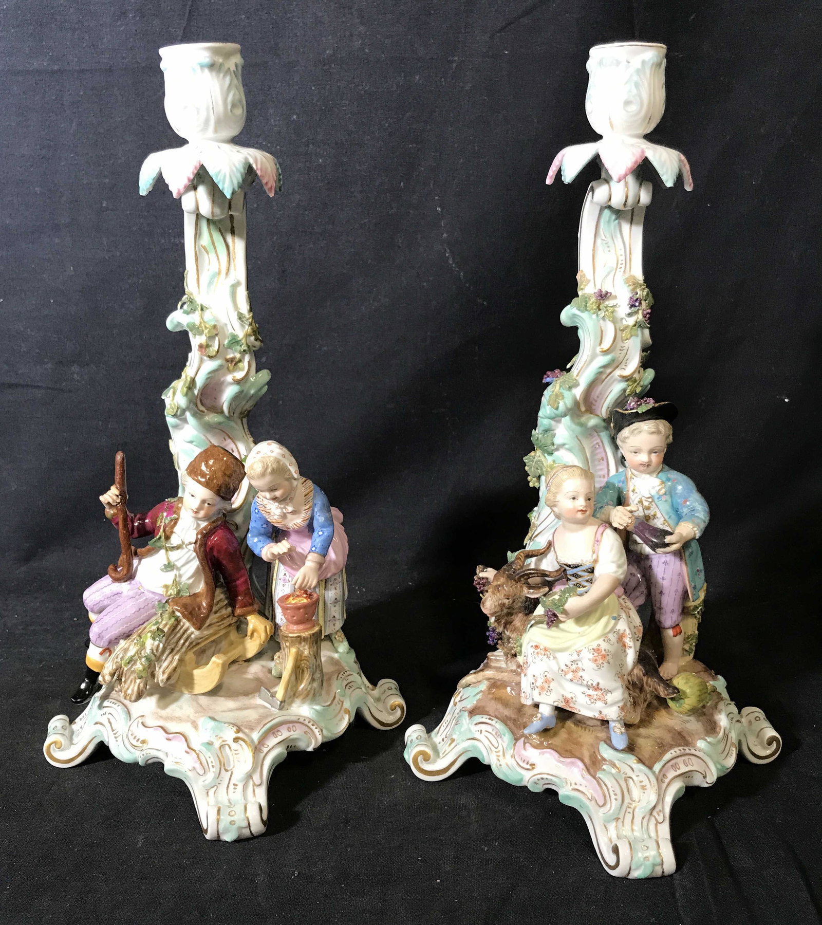 Pair DRESDEN MEISSEN Porcelain Candlestick Holders: Pair Dresden Meissen porcelain candlestick holders, both hand painted, both have the Dresden porcelain symbol to then underside, both display a male and female figure in French attire sitting beneath 