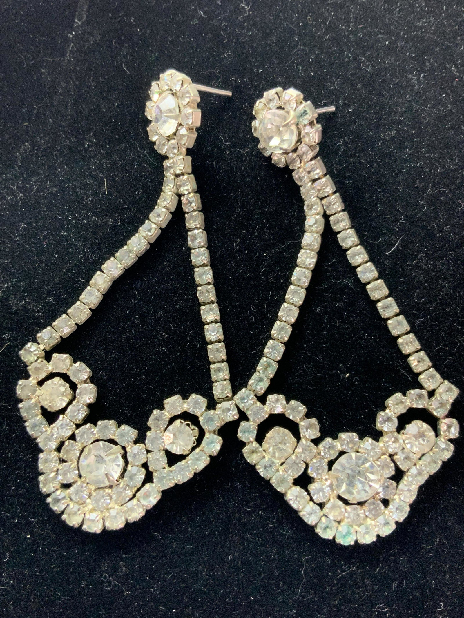Chandelier Crystal Dangle Drop Earrings, Jewelry: Possibly vintage earrings with varying sizes of rhinestone crystal set with four prong settings. Chandelier style. Backings are for pierced ears. Some discoloration on backings and crystals. Approx. L