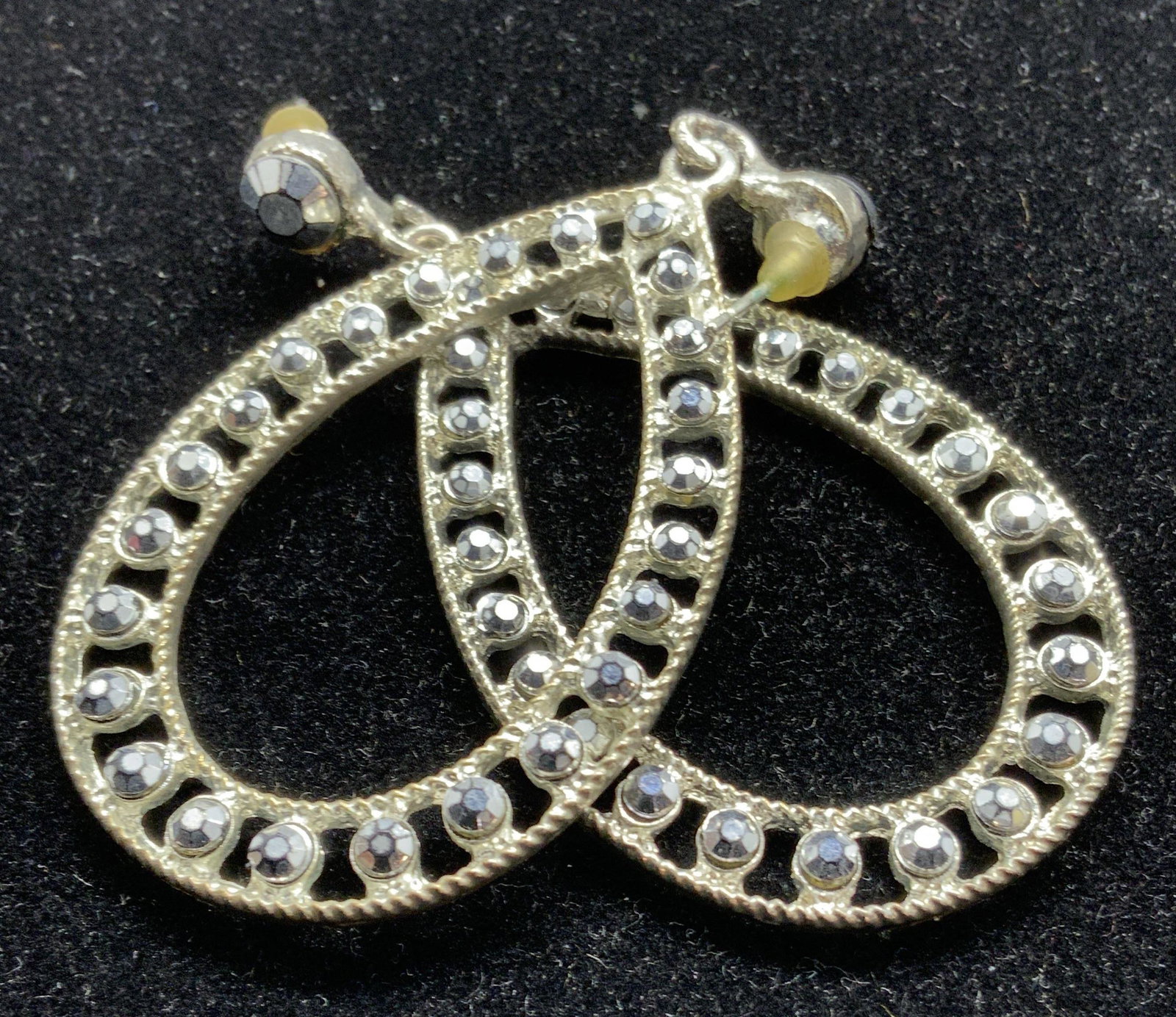 Oversized PEAR LOOP Fashion Earrings, Jewelry: Glittery pair of pierced earrings, posts and rubber backs, open work with Faux hematite AB rhinestone lining open pear loop. 2.75 in long. One earring needs adjustment for hoop to remain on post. Fash