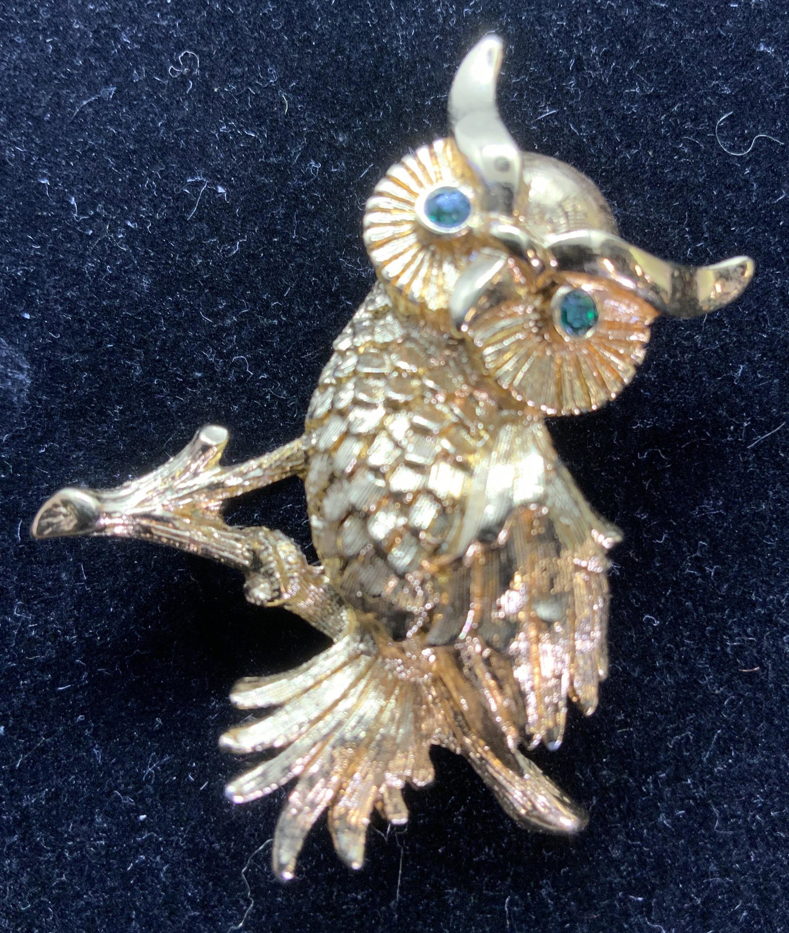 MONET OWL FASHION BROOCH, Jewelry: Gold toned embossed and etched fashion brooch with green rhinestone crystal eyes. owl measures 1.75 in long, about 1.5 in wide. Signed Monet on verso. Signed Monet Brooch, Designer Brooch, Owl Brooch,