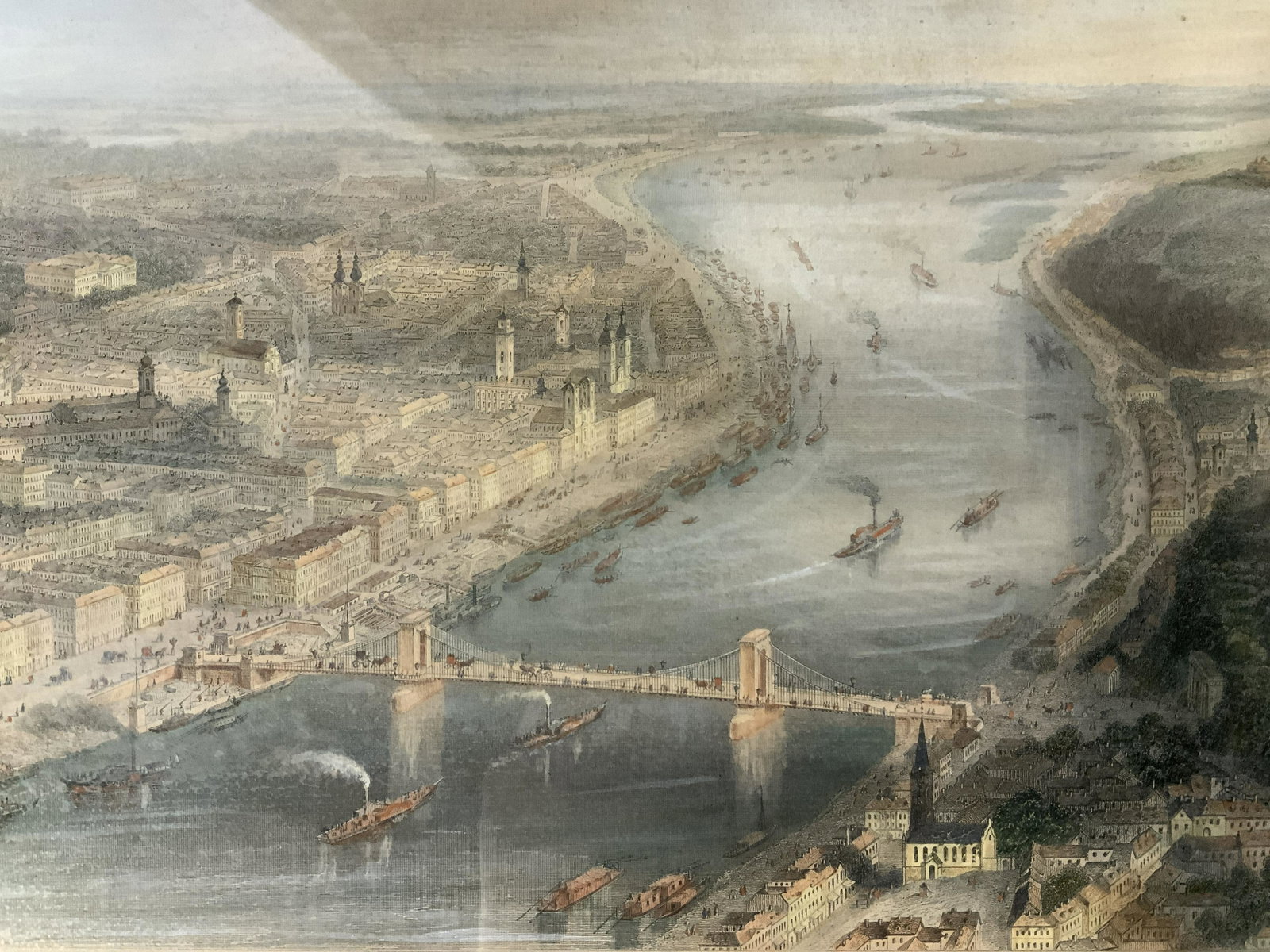 ADOLF ELTZNER Pesth-Ofen Engraving Artwork: ADOLF ELTZNER Pesth-Ofen Hand colored Engraving, inscription to lower portion of piece in German, subject an aerial view of city, measures 12 7/8 x 17 3/4 inches, wooden frame painted gold, Profession
