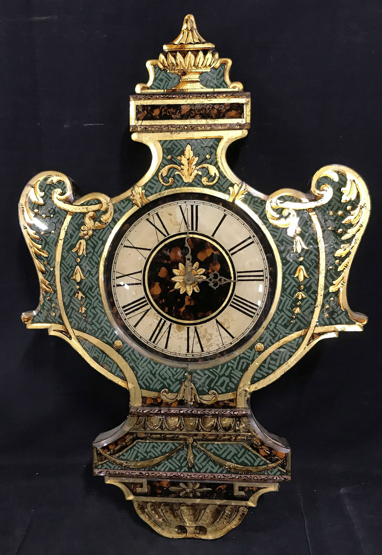 Rococo Hand Painted Glass Wall Clock: Rococo hand painted glass wall clock, no apparent signatures or stamps, subject a metallic hand painted glass clock in a rococo style with gold brown and green being the main colors present, measures