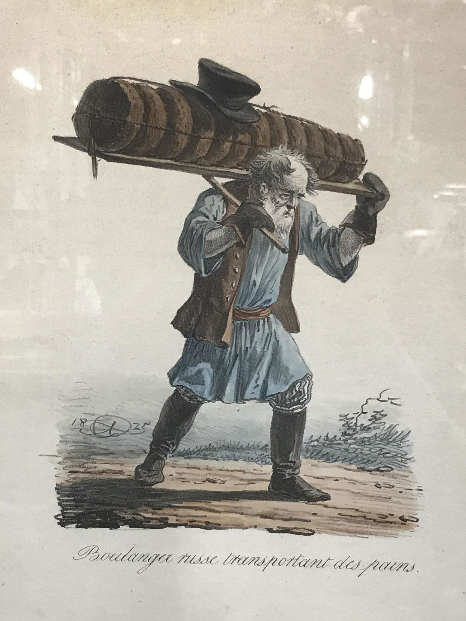 Vintage French Lithograph Artwork: Vintage French lithograph, title to lower border reads ‘boulanger russe transportant des pains’ or ‘Russian Baker carrying breads’, subject an old man carrying baked goods on his back, cork ma