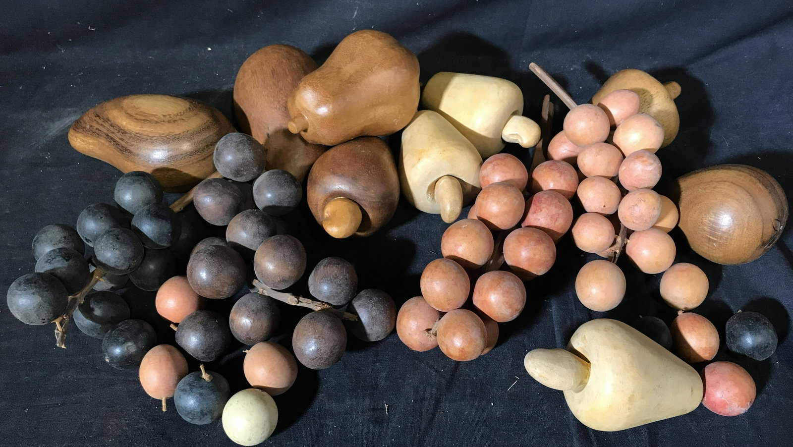 Collection of Indonesian Wooden Fruit Decor: Collection of Indonesian wooden fruit, lot includes 3 cashew apples 4 pears one squash 4 bushels of grapes and 13 individual grapes, largest piece measures 10 inches, Collection, Indonesian art, Indon