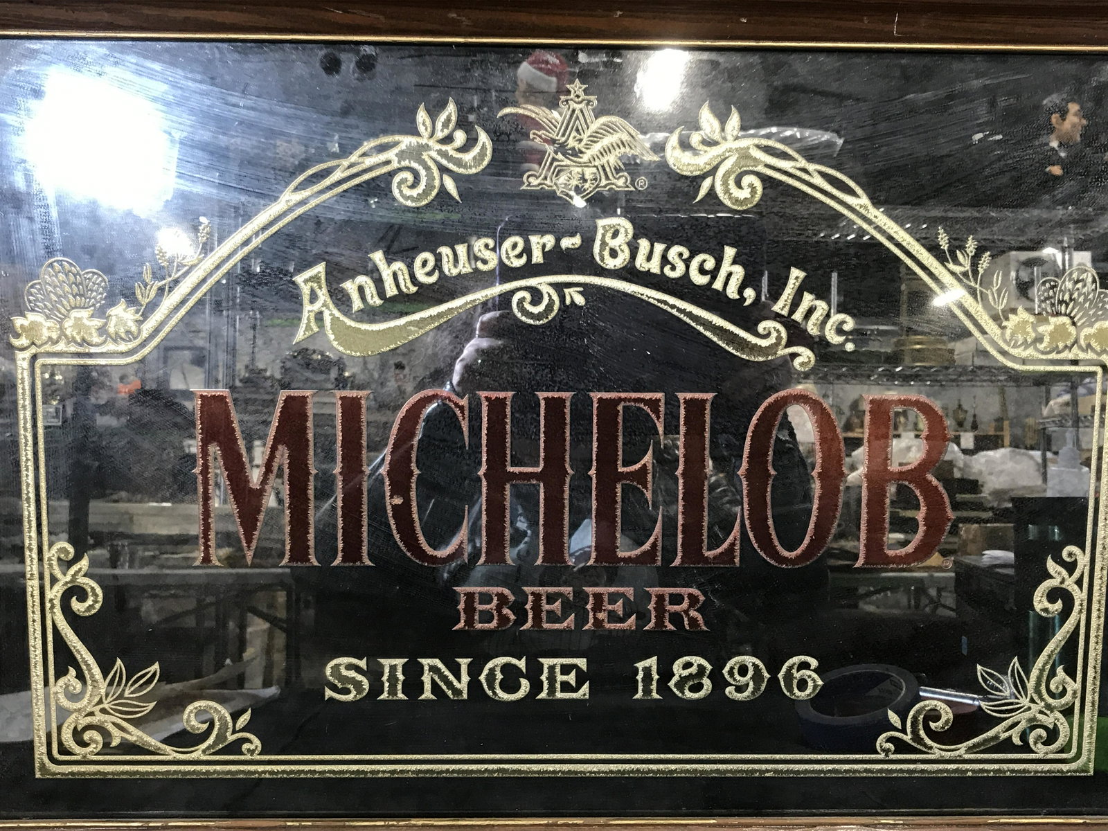 Acryl Etch Mirror Beer Advertisement: Acryl etch mirror beer advertisement, text to piece reads ‘Anheuser-Busch Inc, Michelob, Beer, Since 1896’, piece designed with copper and gold metallic paint, brown wooden frame with gold painted