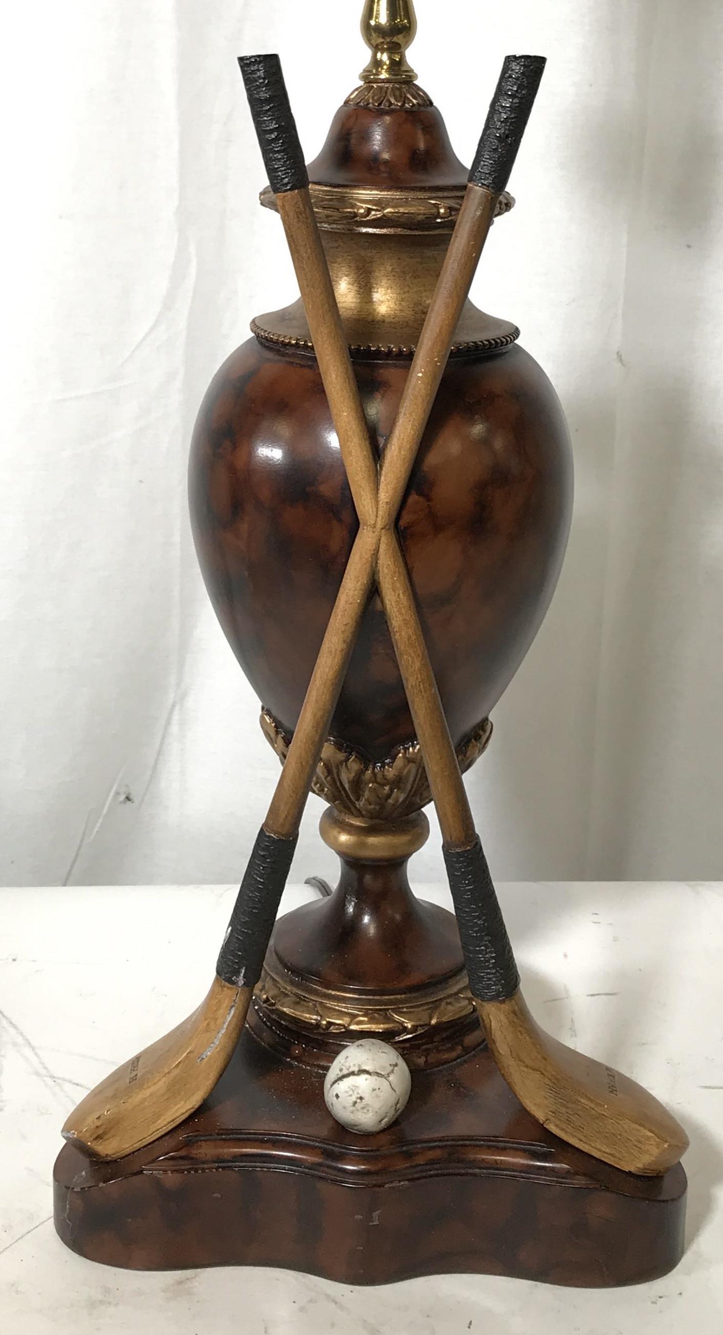 Vintage Golf Themed Tabletop Lamp: Vintage tabletop lamp, golf motif, gilded carved detailing. Measures approx 23.5 inches H, and 9 inches W. Carved wooden golf clubs, names etched into heads of clubs, reads as H PHILPS, M EWAN. Wear i