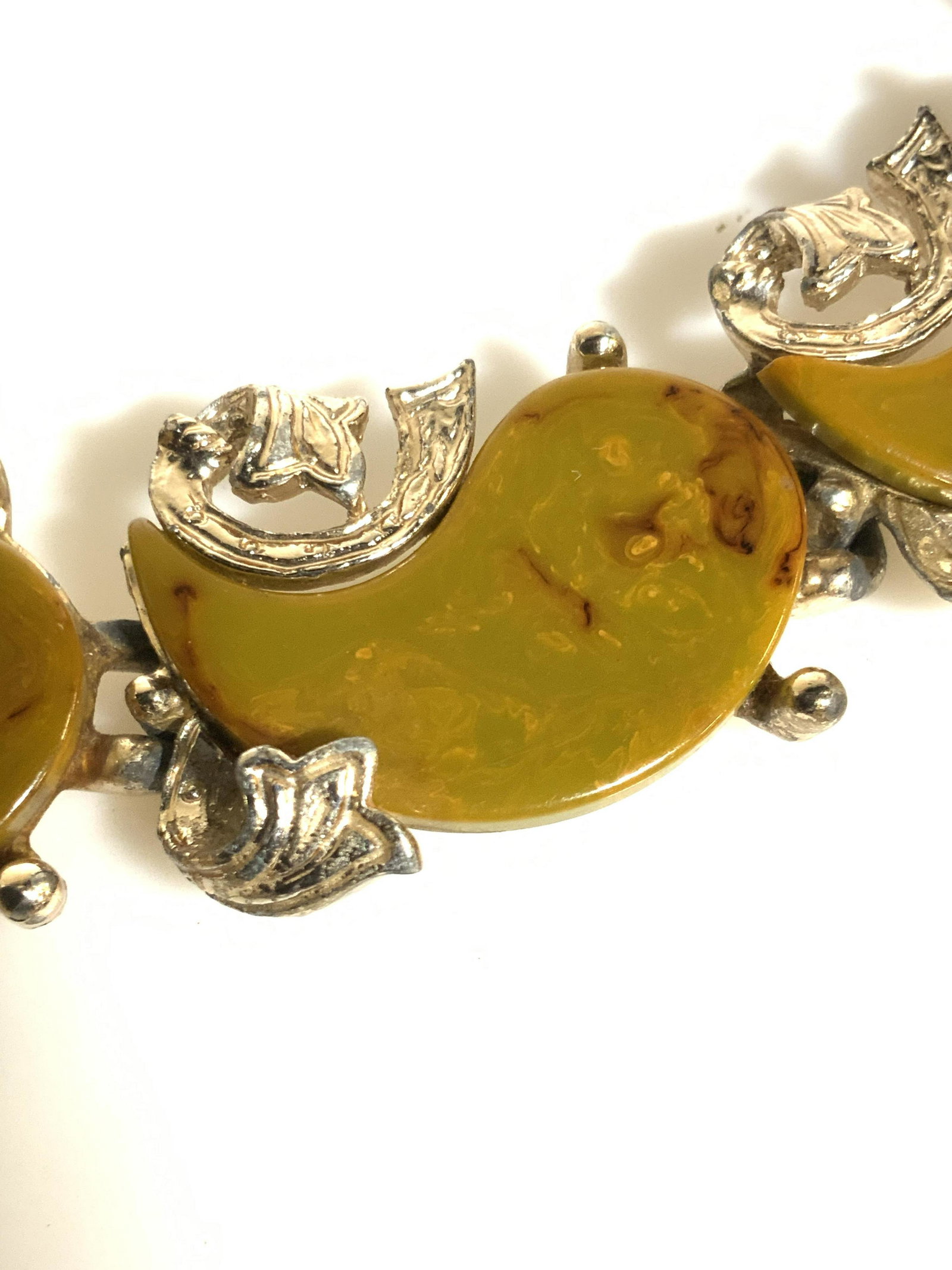 Vintage Jade Style Beaded Costume Necklace Jewelry: Faux Nephrite Jade composite shapes with one half of the yin- yang symbol, also known as the tai chi symbol. Each app 1 in. Wide. Contrasting silver toned etched floral setting under each stone, 16 in