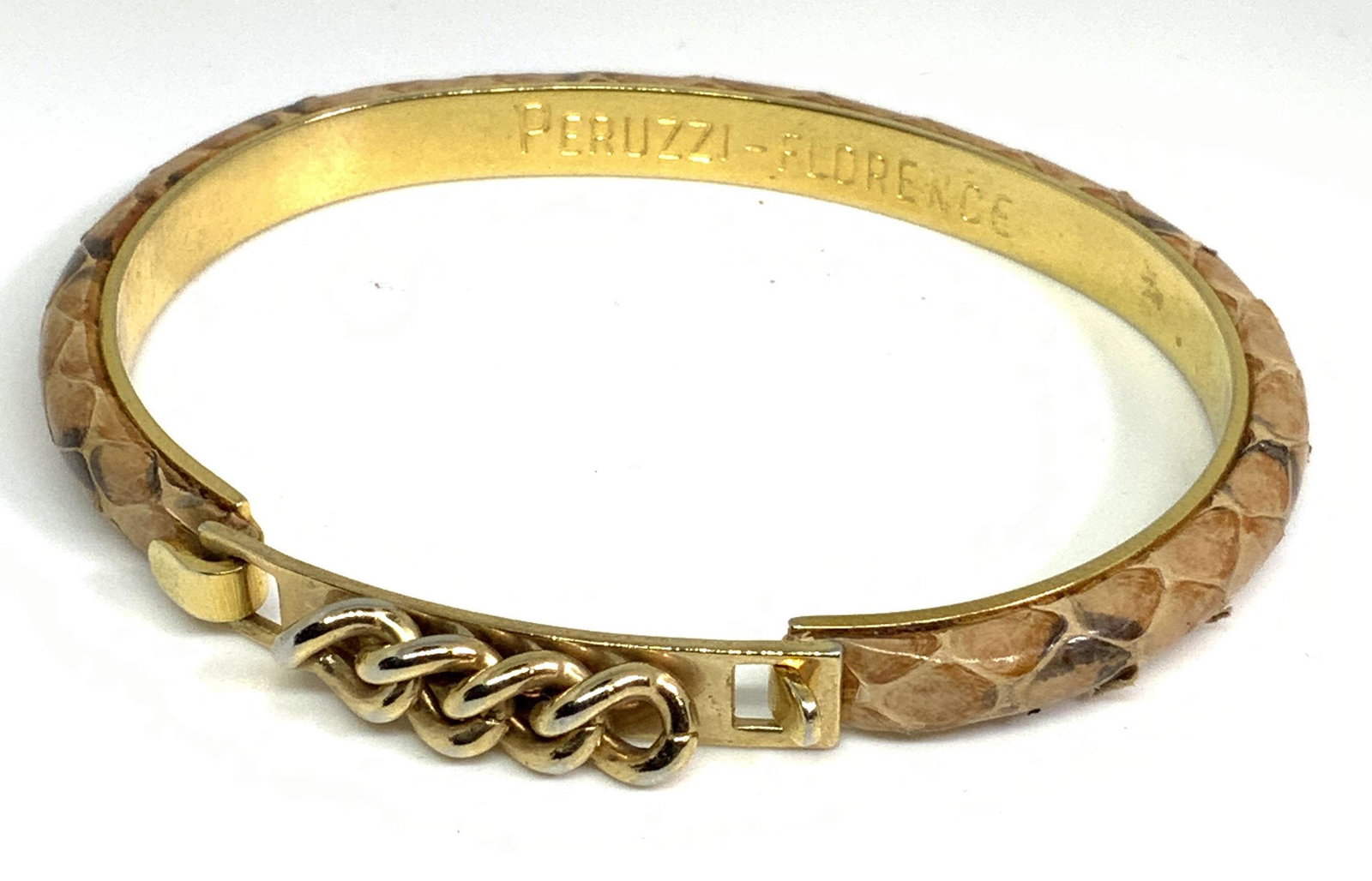 GUCCI PERUZZI FLORENCE Vntg Snakeskin Bracelet: This bracelet is crafted by Peruzzi of Florence, Italy, for Gucci. The bracelet is signed on the interior, reading: Peruzzi Florence. Top of the bracelet features beige snakeskin accented with natural