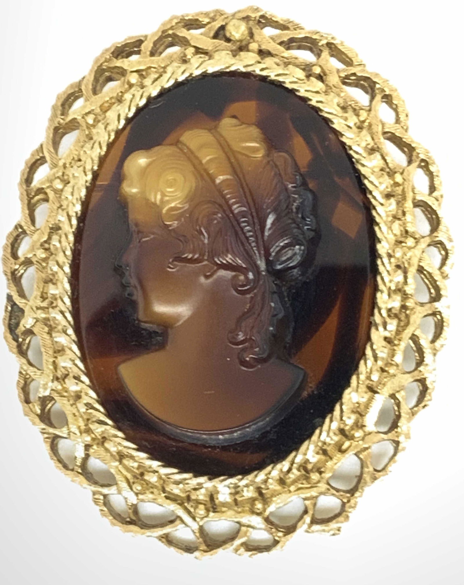 FLORENZA Vintg Sign Victorian Style Cameo Brooch: A vintage pierced gold one metal cameo brooch featuring the portrait of a woman. The women is etched and in relief of the backing. She is gazing off to the left. The cameo has deep brown hues througho