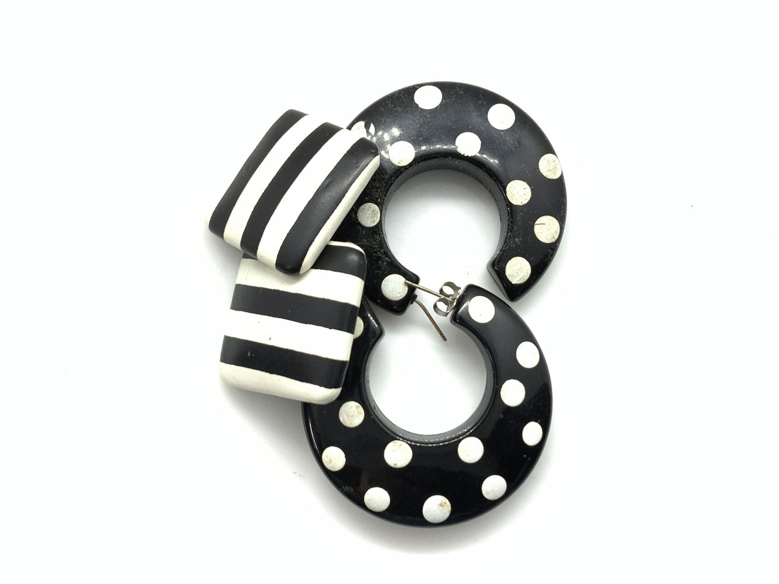 2 Pr Blk & Wht 1980s Fashion Post Earrings: Spanish polka dot painted composite hoops. Needs one backing. 1.75 in diameter. Square Button Earrings, black and white stripes, 1 in. Post and back earrings, polka dot large hoop earrings, Square but