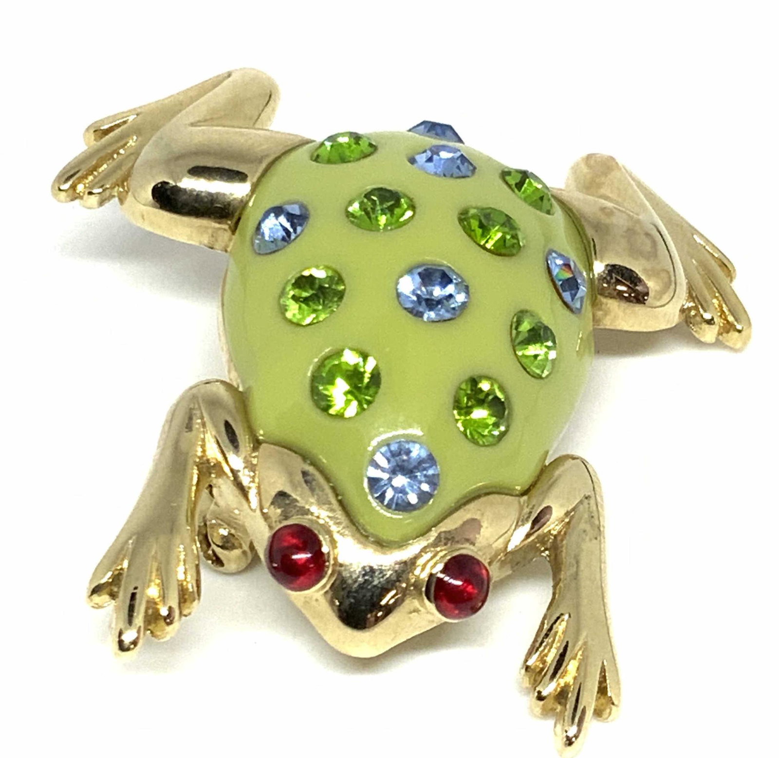 Lot3 MONET Sign Vintg Peacock & Frog Form Pins: A mix of gold tone metal brooches in various forms. The polished peacock gold tone metal form decorated with green and colorless costume cabochons is signed on the underside: MONET. This piece also fe