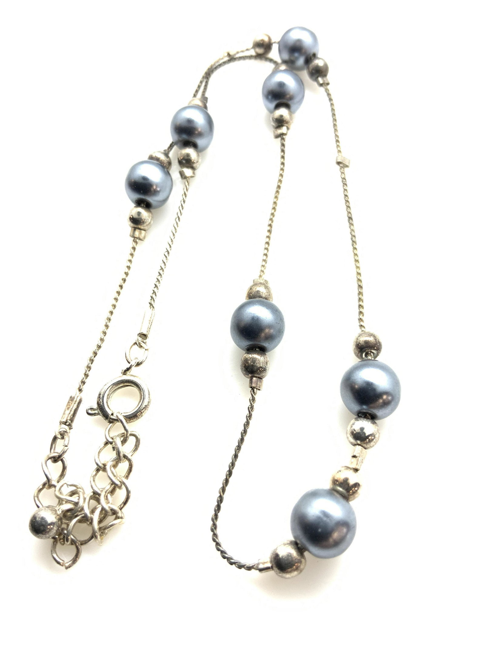 Tahitian Pearl Style Accent Necklace, Jewelry: Silver tone chain with several grey- blue toned Tahitian style pearls flanked by silver toned spheres. Spring ring clasp. Adjustable length, 15-16 in. Tahitian pearl style costume necklace, classic pe