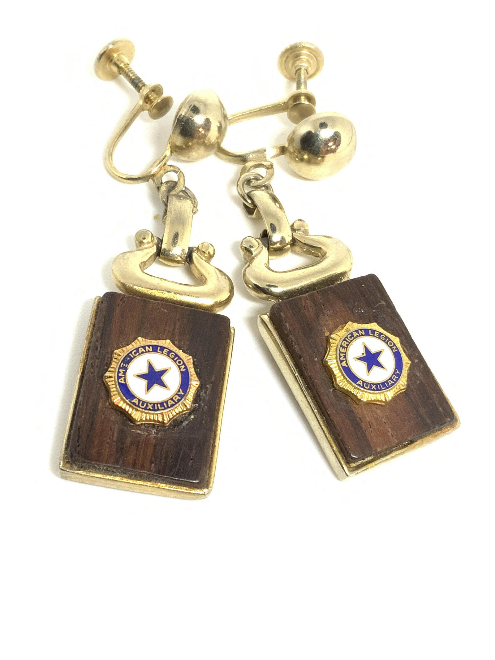 Set2 AMERICAN LEGION AUXILIARY Necklace & Earrings: A matching set of vintage earrings and a necklace. Each piece is crafted from gold tone metal with mock rich brown wood accents. Small circular plaques adorn one panel on the necklace and both of the 