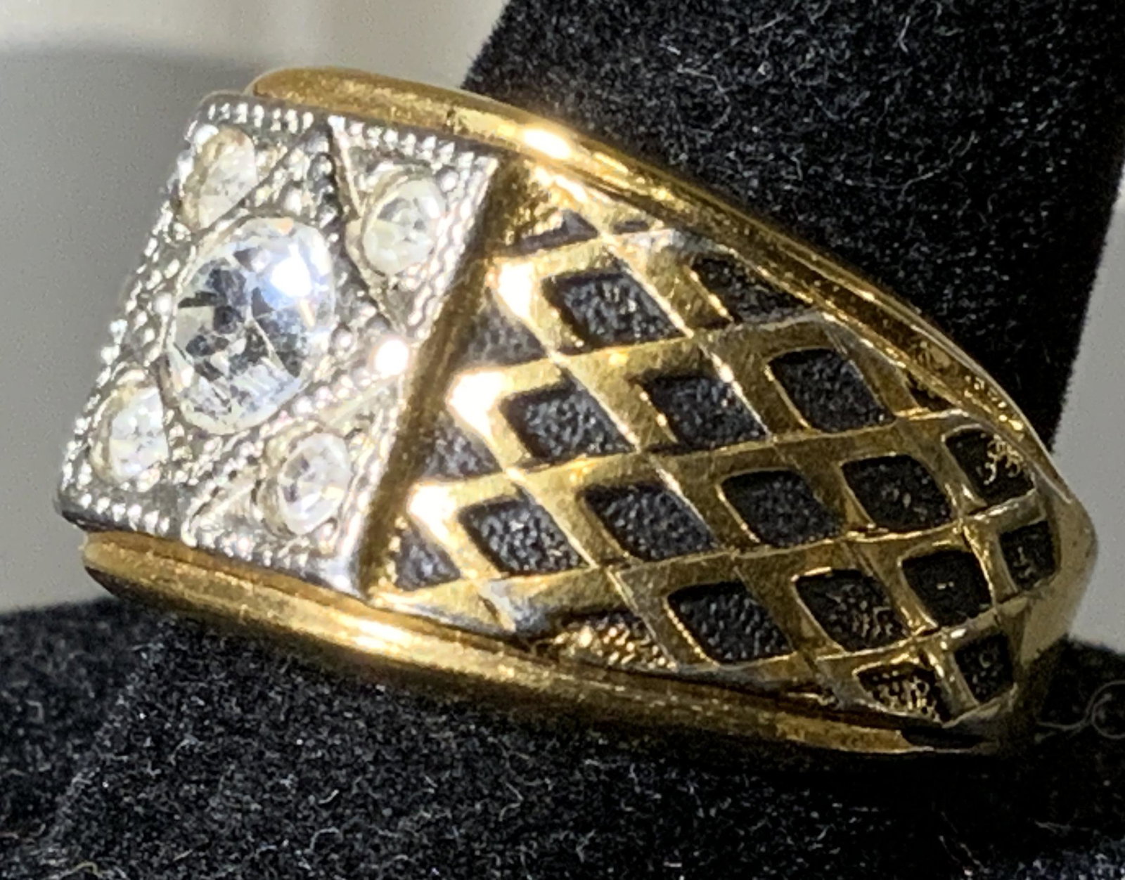 18 K Gold Electro Plate & Crystal Ring: Impressed Diamond pattern shanks with rubbed black enamel gives this ring dimension, add to the center stone and head design, giving an antiquated early 1930s deco style. Sz 6.5 app. Reads 18K Electro