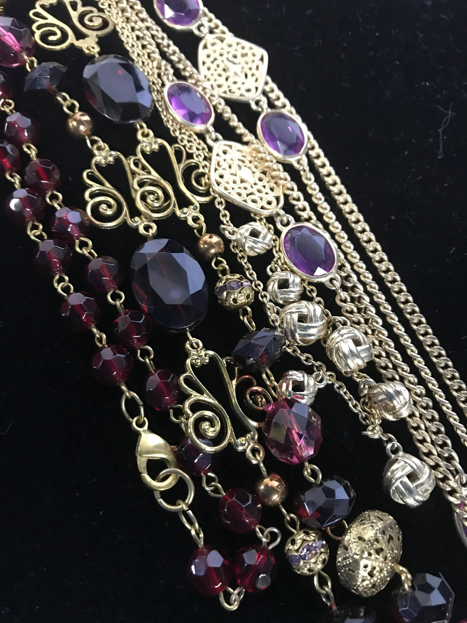 Set 3 Purple and Gold Tone Necklaces, Jewelry: Grouping of three vintage chain necklaces one with purple toned glass beads and gold toned diamond shapes in style of Chanel measures 26 inches opera length,signed Sarah cov, second chain necklace in 
