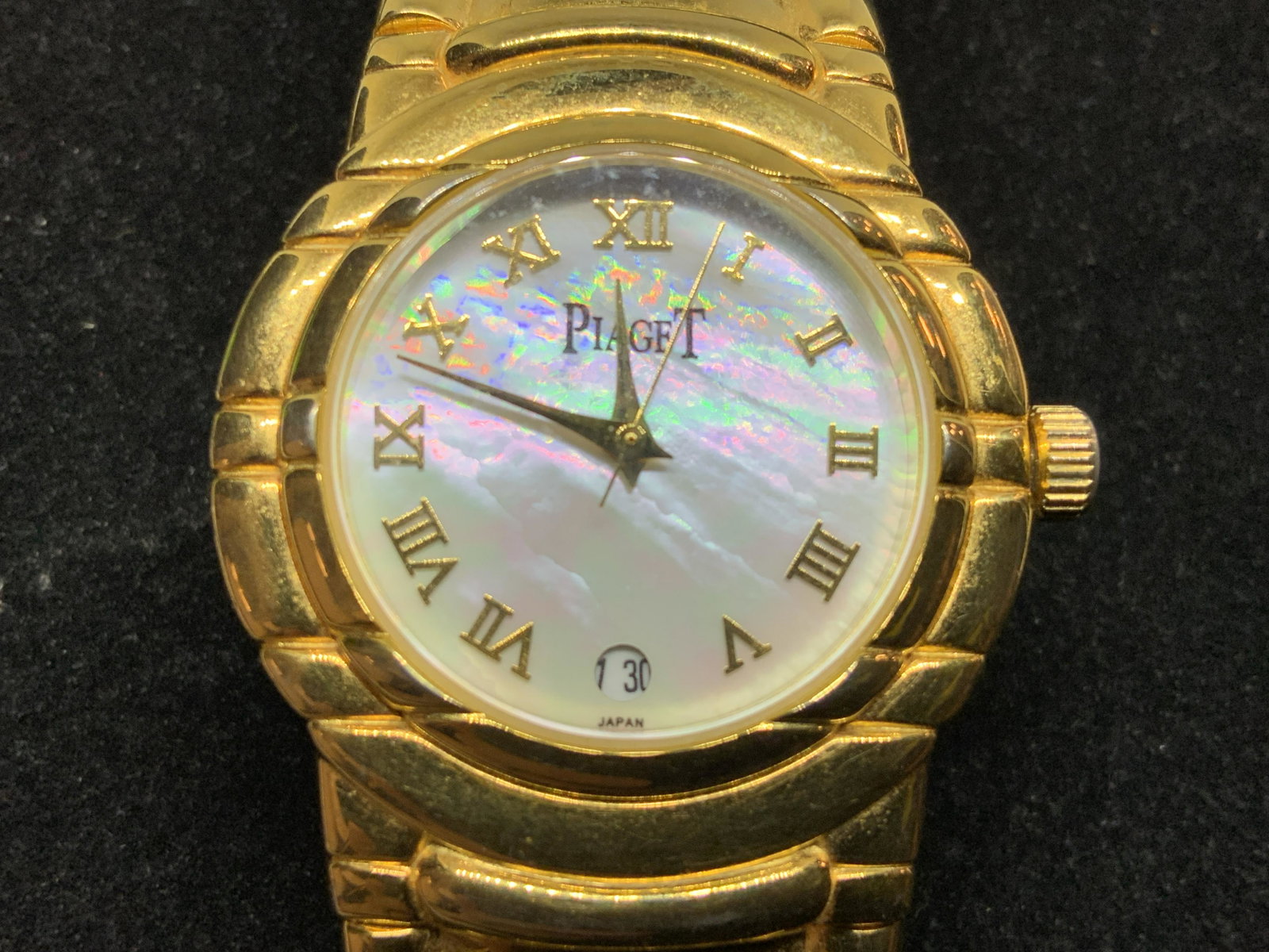 PIAGET Gold Toned Metal Watch, Jewelry: Piaget Gold toned Metal Weighty Watch, inscription to reverse reads ‘Piaget’, inscription to face of watch reads ‘Piaget’ and ‘Japan’, piece is made of a weighty gold toned metal with a pe