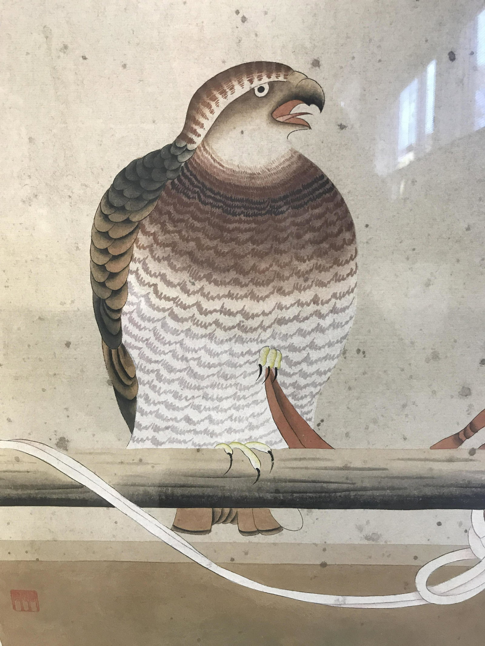 Signed Chinese Hand Painted Bird Artwork: Chinese Hand Painted Bird, red Chinese character stamp to lower left section, subject a bird of prey with puffed chest perching on a pole with ropes twisted round it, matte black wooden frame, measure