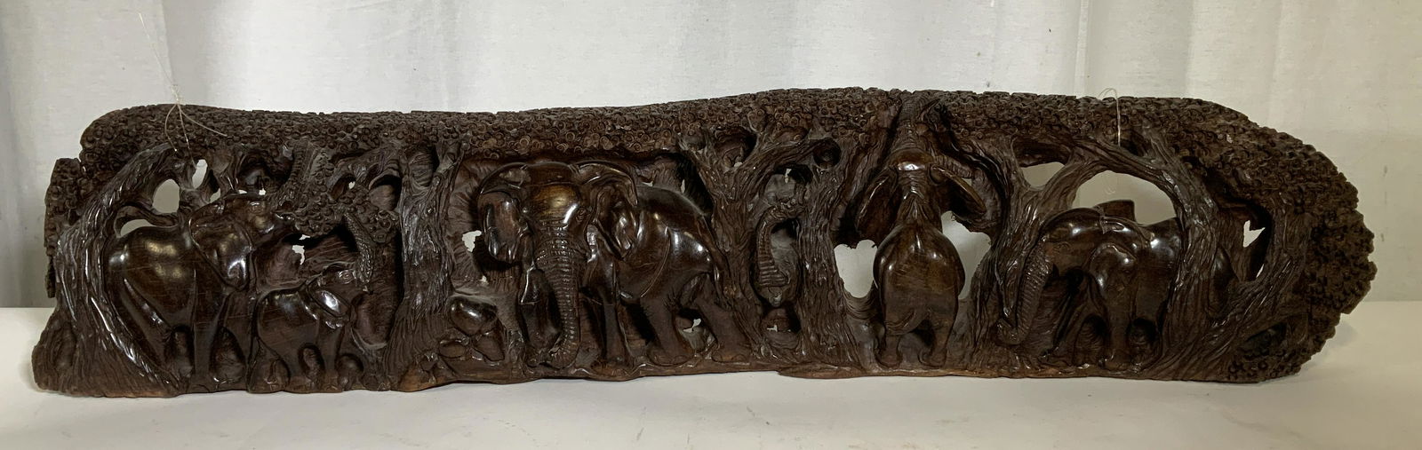 African Wooden Relief Panel, Elephant Grouping: African Wooden Relief Panel, Elephant Grouping, no apparent inscriptions or signatures, Subject elephants amongst trees, measures 6 1/2 inches at highest point x 33 inches wide, some scratches but ove