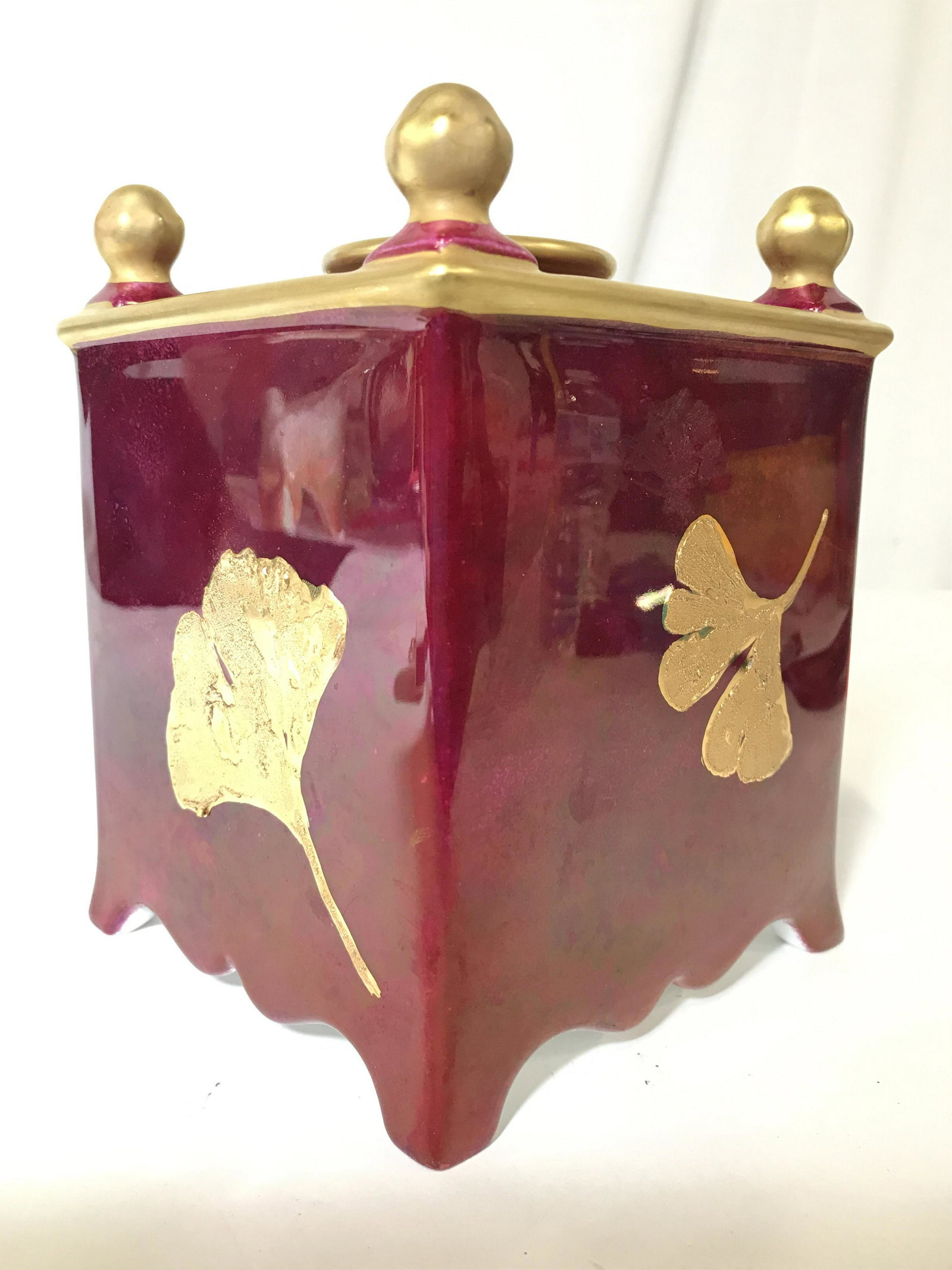 LIMOGES France KARIN RETA Signed Vase W Insert: Underside appears to be signed KARIN RETA and is marked LIMOGES FRANCE. Piece is cranberry and gold toned. Piece is porcelain. Includes porcelain lid insert with multiple openings and mouth in center.