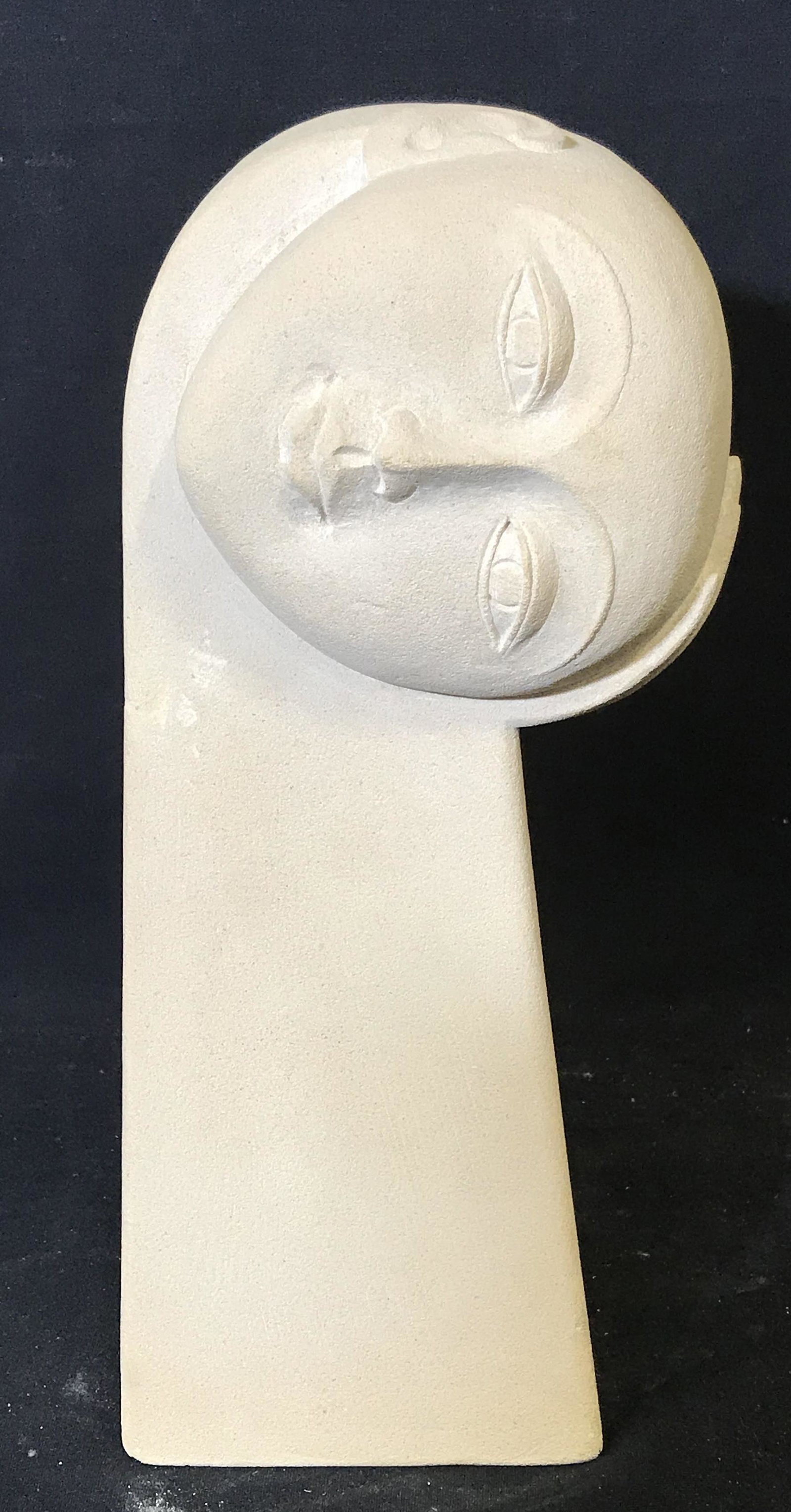 RAKA Signed Modern Stone Sculpture: RAKA signed modern stone sculpture, signature to reverse reads ‘Raka’, labels to reverse read ‘Thunderlake’ and ‘Made in Indonesia’, subject a rectangular block with a head tilted to the s