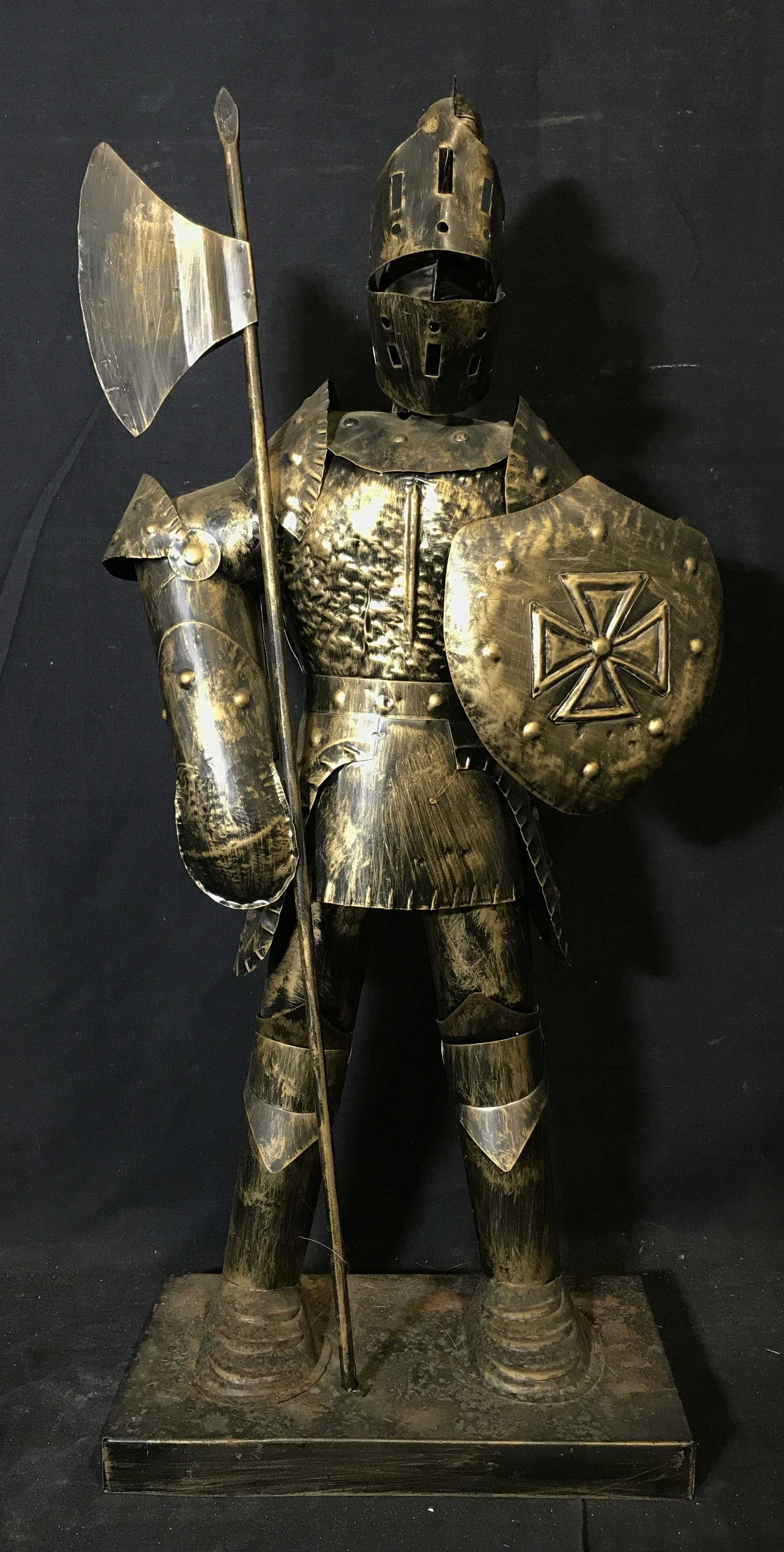 Metal Statue of Knightly Armor with Halberd: Metal statue of knightly armor with Halberd, no apparent signatures or stamps, subject a set of knightly armor holding a Halberd and shield in other hand, hollow statue, made of a black toned metal pa