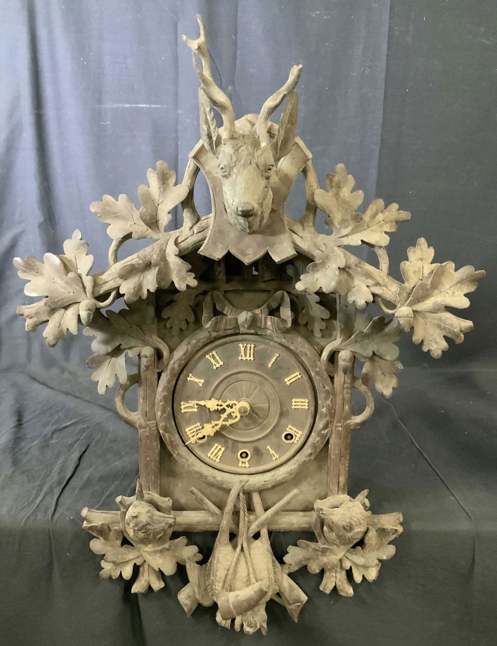 Vintage BLACK FOREST Cuckoo Clock: Vintage BLACK FOREST Cuckoo Clock, vintage possibly antique, hand carved woodland animals and vegetal details, measures 27 1/4 inches x 19 3/8 inches at widest point, projection measures 12 1/2 inches