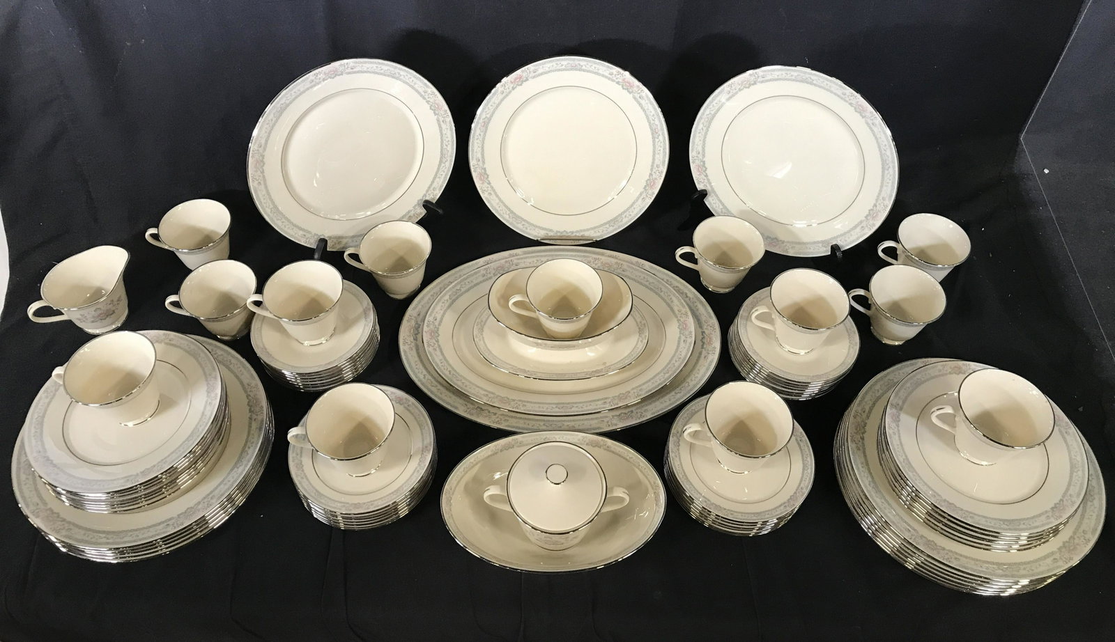 Lot 73 LENOX Porcelainware China Set: Lot includes 13 teacups 14 saucers, 13 salad plates, 14 dinner plates, 13 bread plates, 1 gravy boat, 1 creamer, 1 sugar with lid, 1 oval serving bowl, 1 mid size oval serving dish & 1 large size oval
