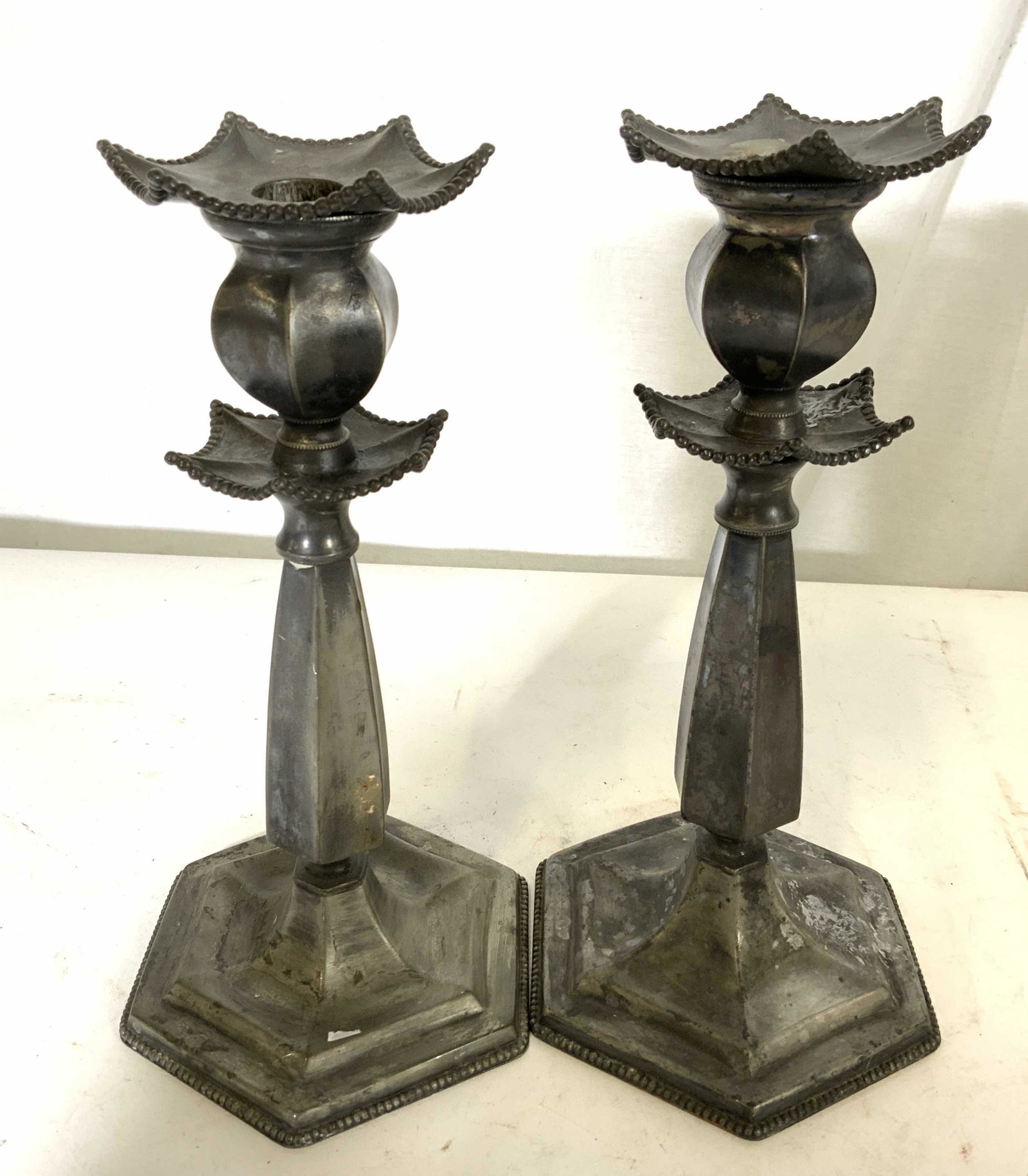 Pair Antique E.G WEBSTER &Sons S/P Candlesticks: Circa 1890, Pair of Silver plate candlesticks, signed and hallmarked for E.G. Webster & Sons, antique, American , gothic manner type 1101, tapered faceted columns, hexagonal base, bead trim and remova