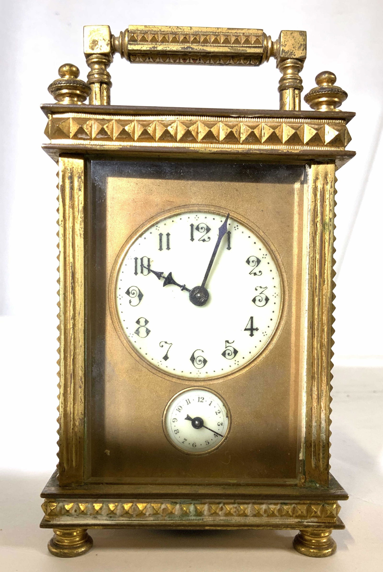 Antique Gilt Metal Bronze Carriage Clock: Vintage possibly antique gilded metal and glass framed clock, trademark inside of curled art nouveau floral on stem, detailed etched metal relief to trim, measures app ht to carriage finial 6.5 inches