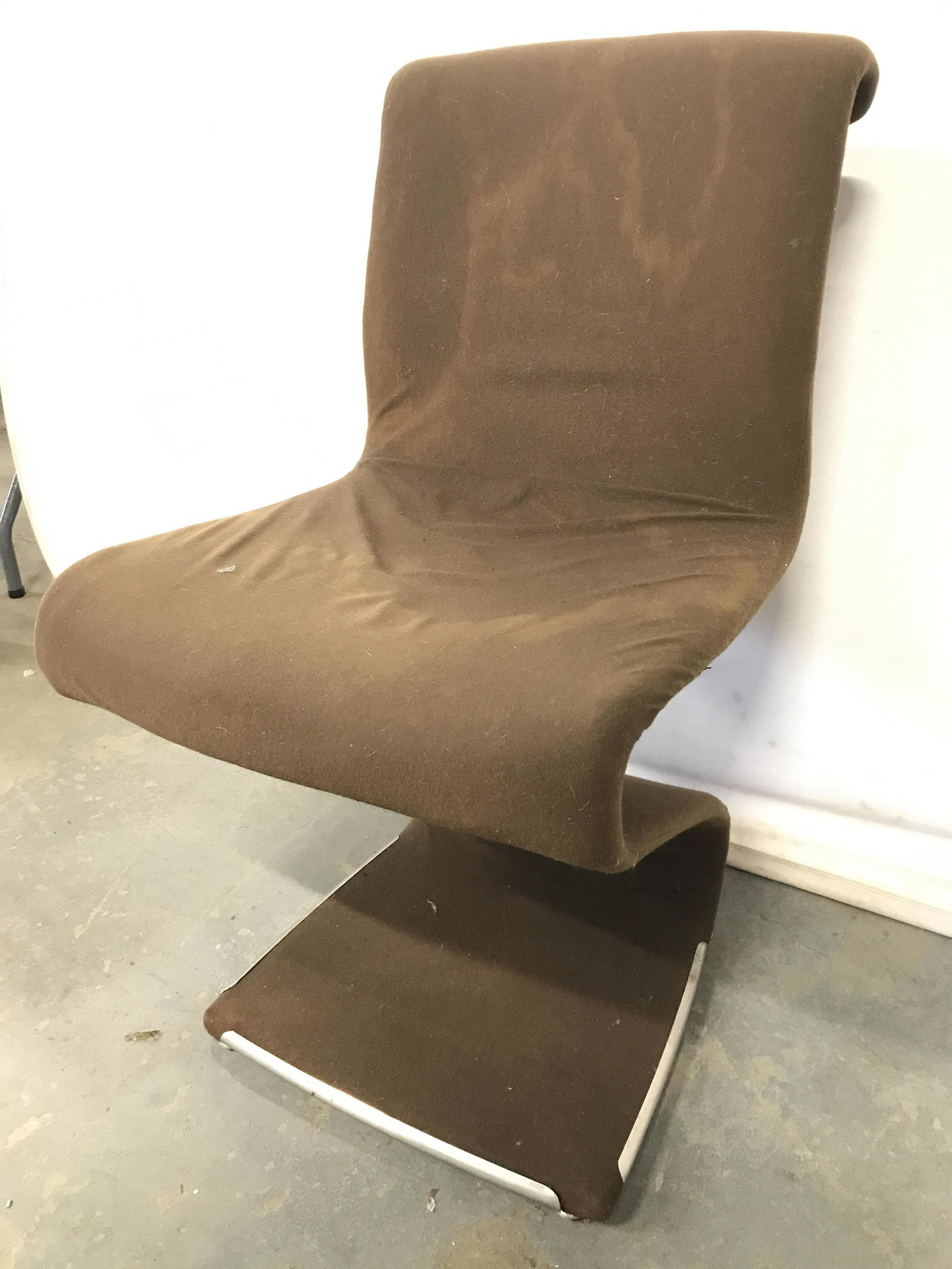 Mid Century Modern Zig Zag Chair W Chrome Frame: Chair is mid century modern. Piece is brown toned. Chair has zig zag shape structure. Piece has chrome frame. Chair measures approximately 33 inches tall 18 inches wide 22 inches deep. Mid century mod