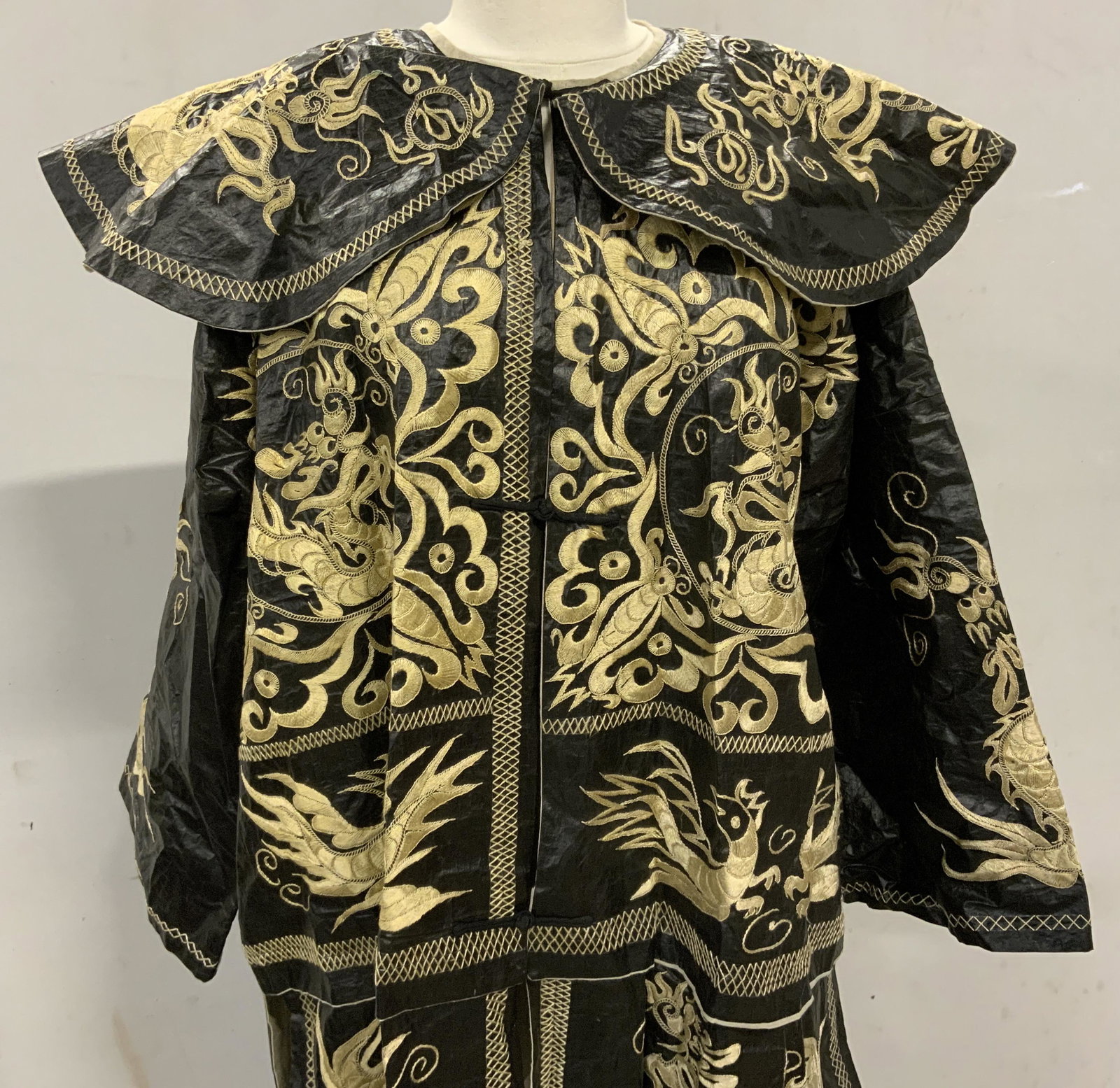 Vintage Black Chinese Style Embroidered Court Robe: Vintage Black Chinese Style Embroidered Court Robe, no apparent inscriptions or labels, interior fabric likely linen, exterior fabric possibly nylon, measures 47 1/2 inches long, sleeves measures 25 i