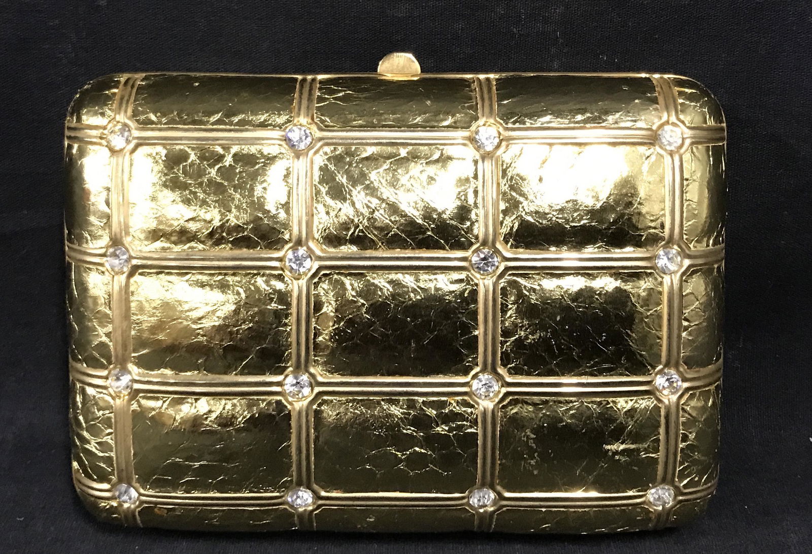 SASHA Gold toned Hand Bag/Clutch: SASHA gold hand bag/clutch, label to interior reads ‘Sasha, Made in China’, made of a bright gold toned material possibly PVC with clear sparkly stones throughout, gold metal accents to piece, som