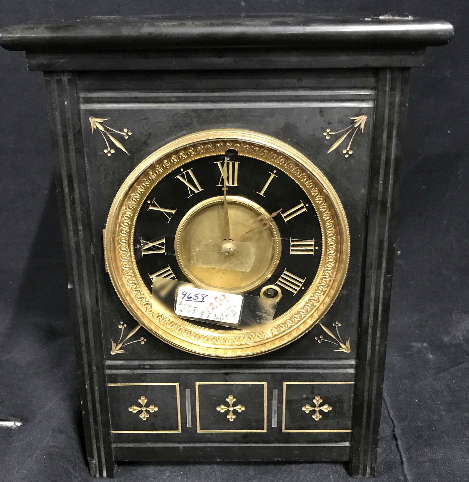 MITCHELL VANCE & Co Stone Mantle Clock: Mitchell Vance & Co. Stone Clock, piece is made of a black stone with gold metal and gold painted accents, label tapped to window to face of clock reads ‘9658 LINC 5-17-95 LOT A, 1279’, door to re