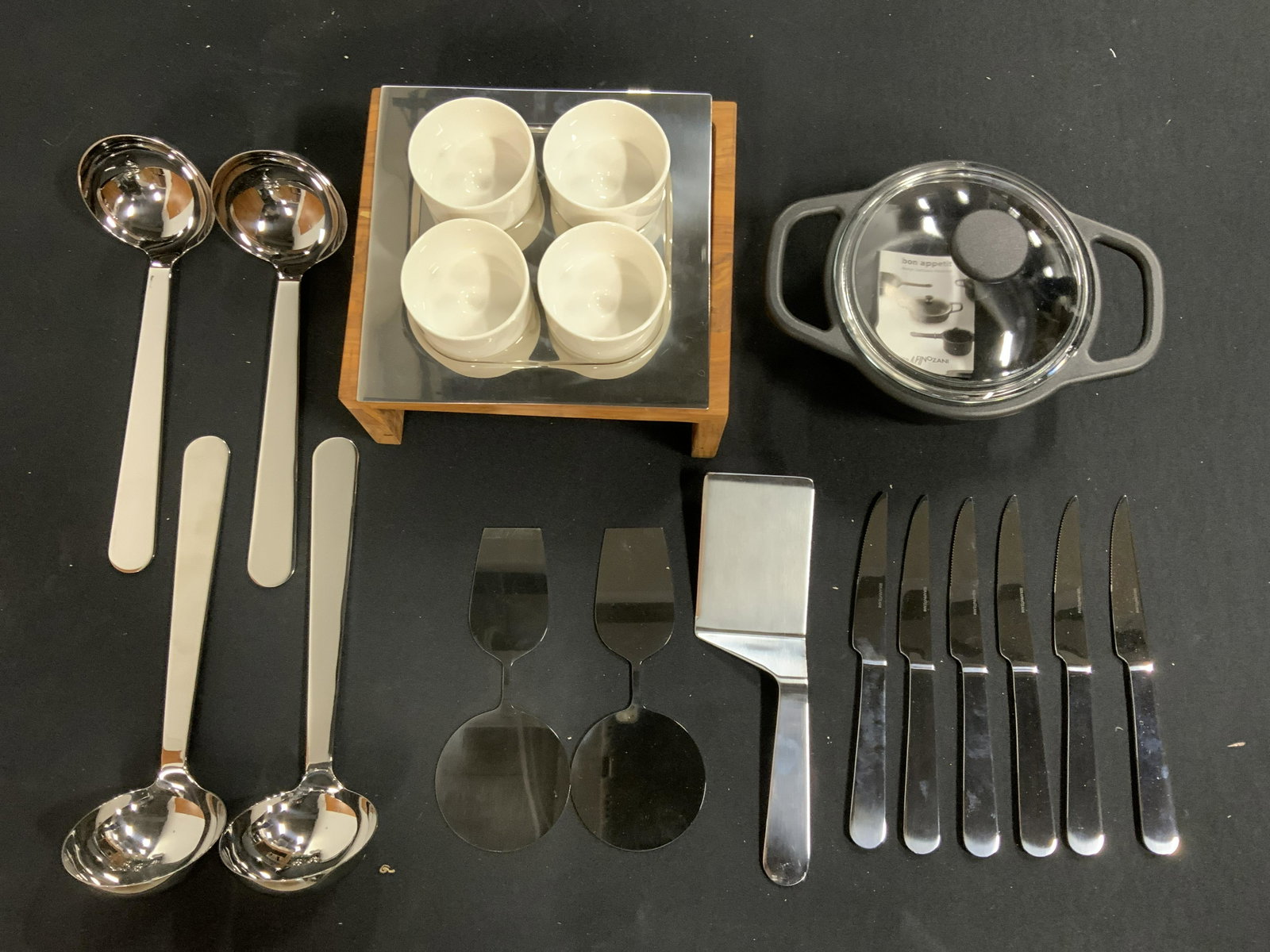Group Lot Dinnerware Donated by AMEICO: Group Lot SERAFINOZANI Dinnerware Donated by AMEICO, Group lot of new and packaged merchandise donated by AMEICO, Group lot includes 4 teacups, 4 ladles, cooking pot, 6 knives, and 3 cake servers, Eac