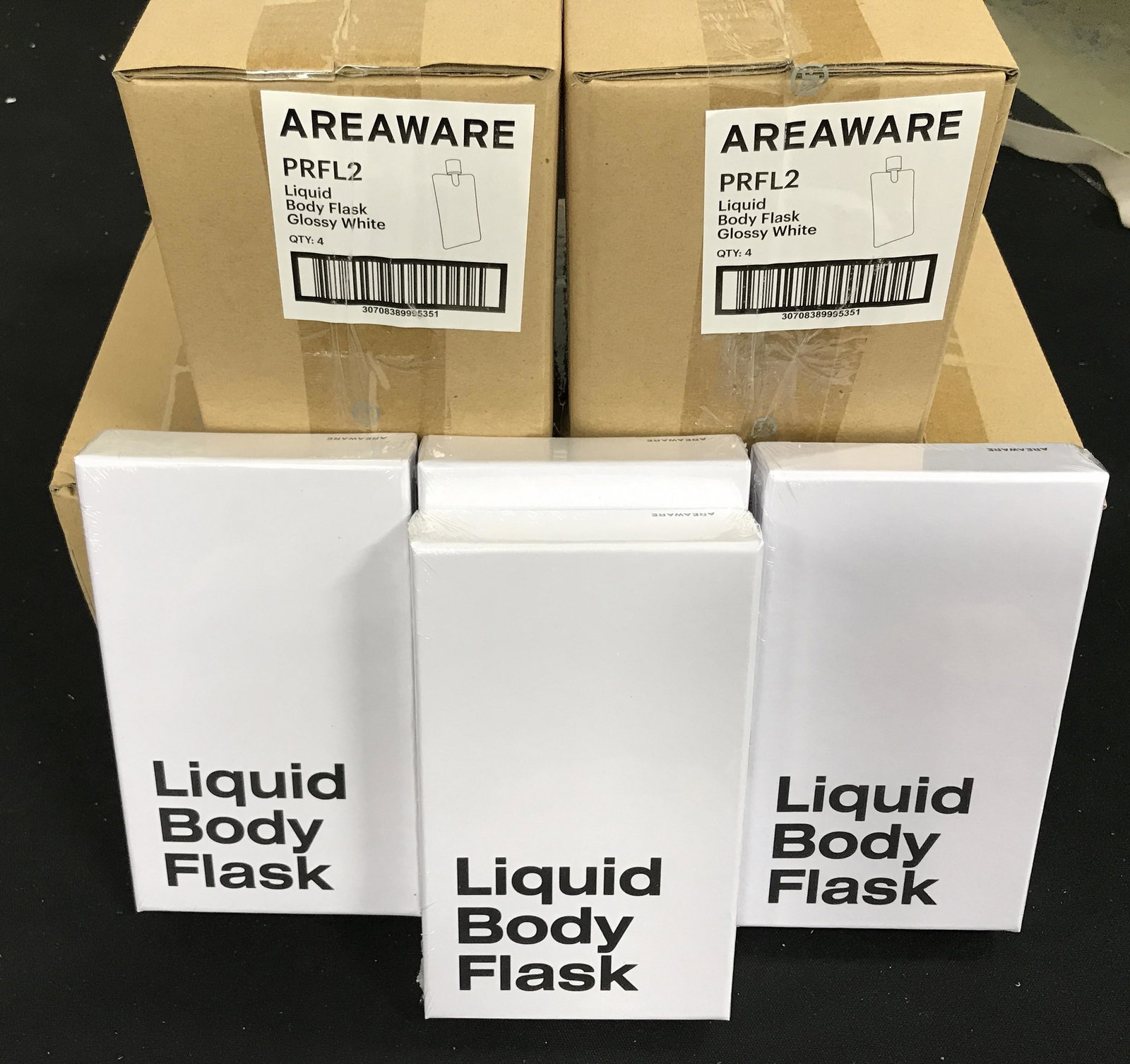 Group 12 New Flasks Donated from AREAWARE: Group Lot includes 12 new and packaged flasks donated from AREAWARE, Each flask comes in original box, group lot of new and packaged merchandise donated by AREAWARE, group lot glossy white stainless s