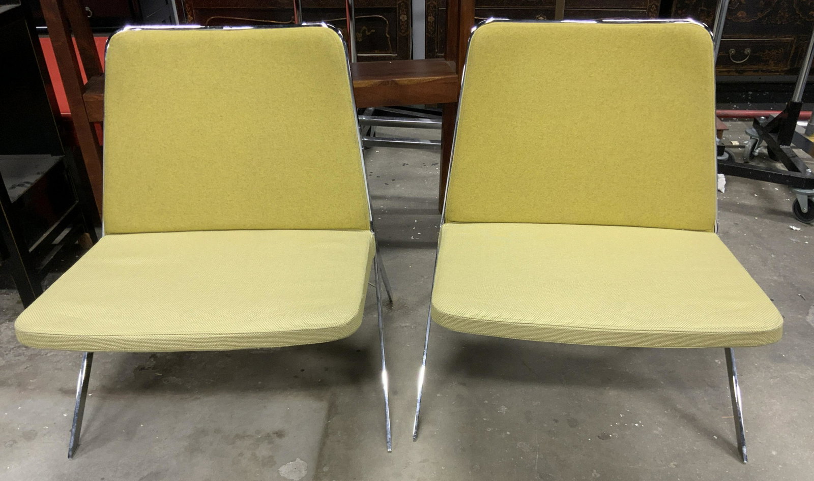 Pair STUDIO TK Keele Lounge Chairs: Pair of lounge chairs by STUDIO TK. seat and back are up holstered in olive green tones, upholstery is of different types, for seat and back. Frame is metal, chromed. Backside of seat is wooden. Measu