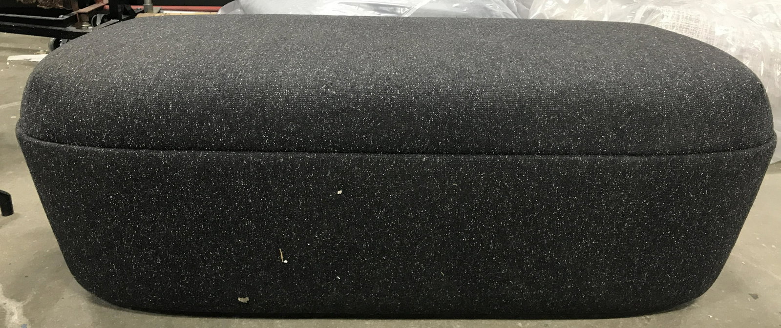 STUDIO TK CESTO Bench Ottoman on Castors: Upholstered CESTO BENCH by STUDIO TK. UPHOLSTERY IS ash toned. Measures approx 17.75 inches H, 51.5 inches W, and 25.25 inches deep. Base is plastic and on wheels. Wear is consistent with age and use.