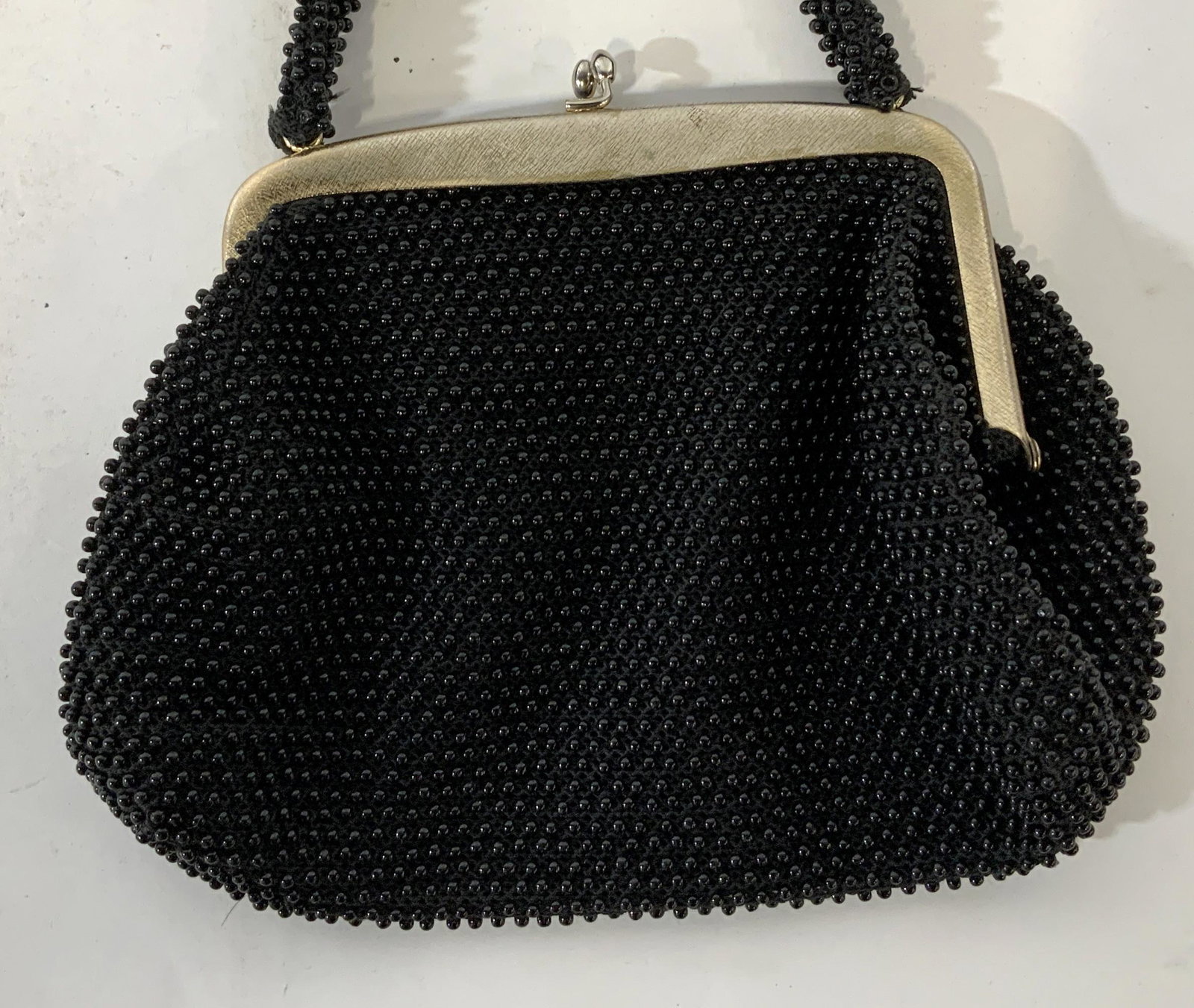 Vintage CORDE BEAD Handbag: Vintage CORDE BEAD Handbag, inscription to interior partially illegible but reads ‘CORDE Bead Made in USA’, measures 6 5/8 x 8 7/8 inches at widest point, drop measures 4 3/8 inches, some tarnishi