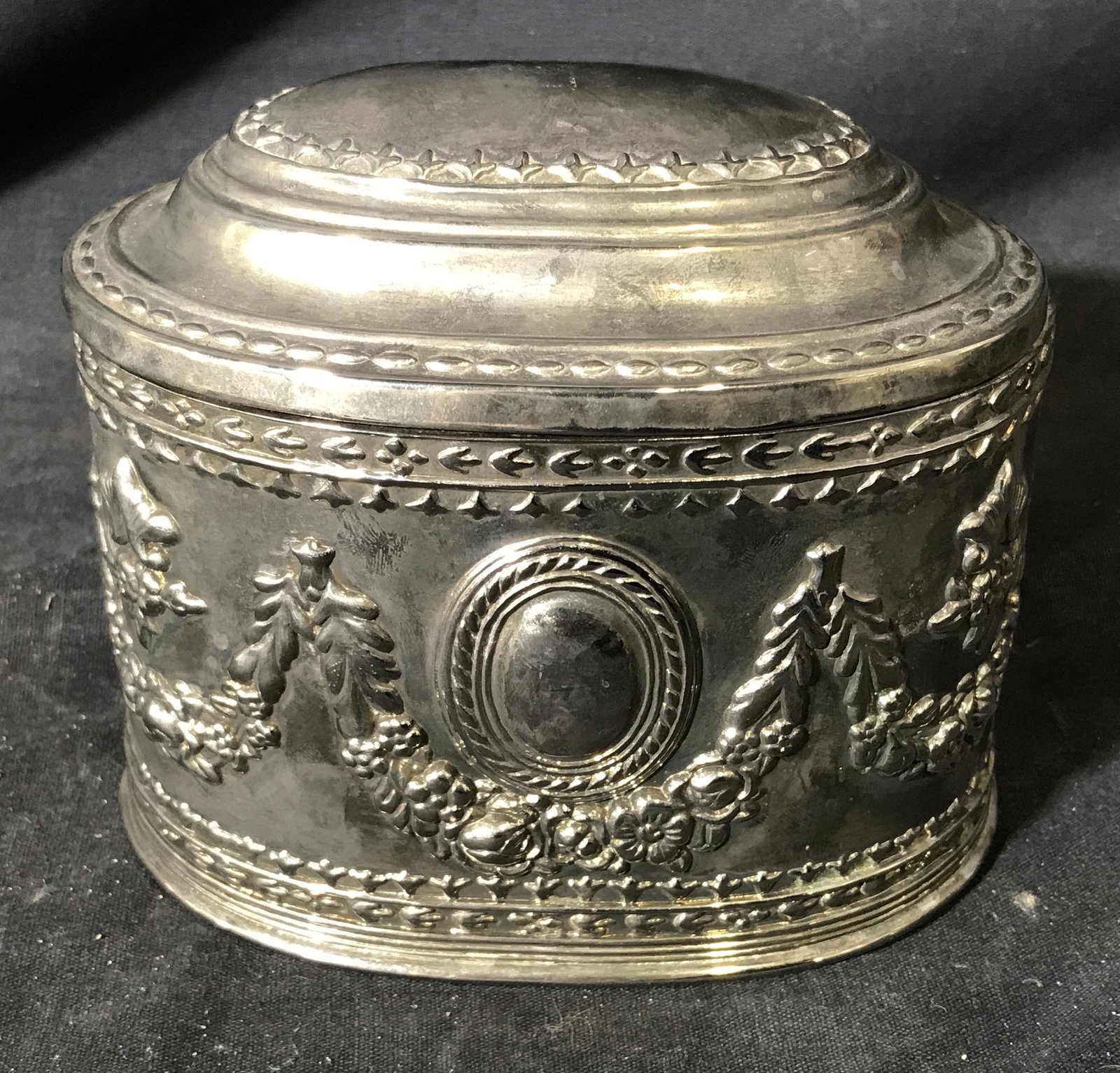 Antique Sterling Silver Plate Lidded Box: Antique possibly sterling silver plate lidded box, no sterling silver stamp, interior lined with red velvet, surface of box embossed with vine and vegetal designs, lining attached to walls of box, pos
