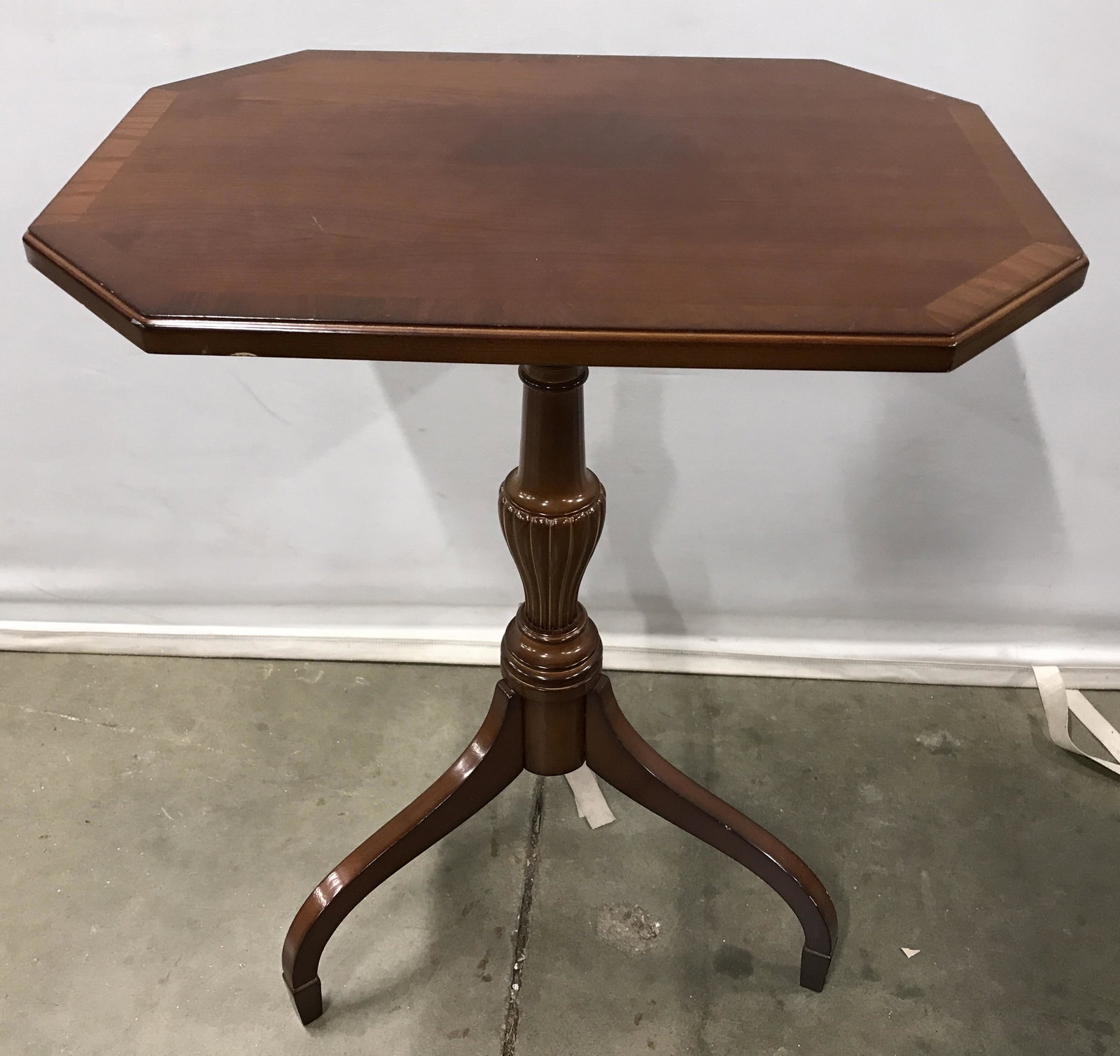 BOMBAY COMPANY Wooden Side Table: Wooden Side table. Pedestal table, column end in three legs, feet taper downward, part of column is reeded and bulbous. Table top is octagonal. Measures approx 27 inches H, 22 inches W, and 16 inches 
