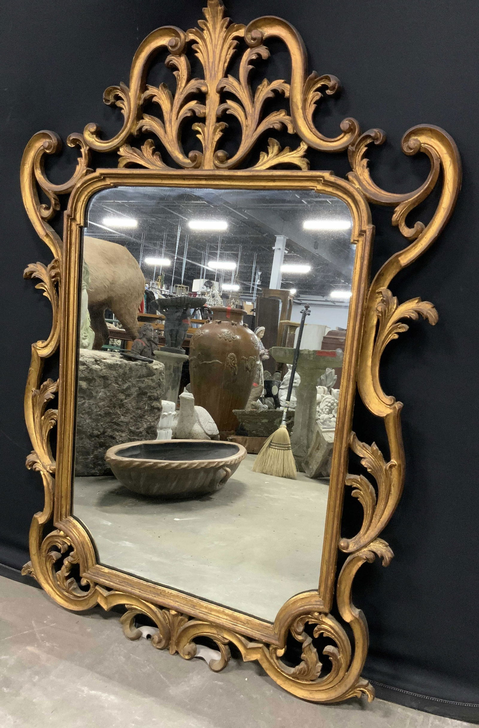 Vintage Carved Wood Frame Mirror, Italy: Vintage, possibly antique, wood frame mirror. Frame is hand painted and gold toned. Leaf like design. Measures approx 46 inches H, and 32 inches W. Wear is consistent with age and use. Etching on back